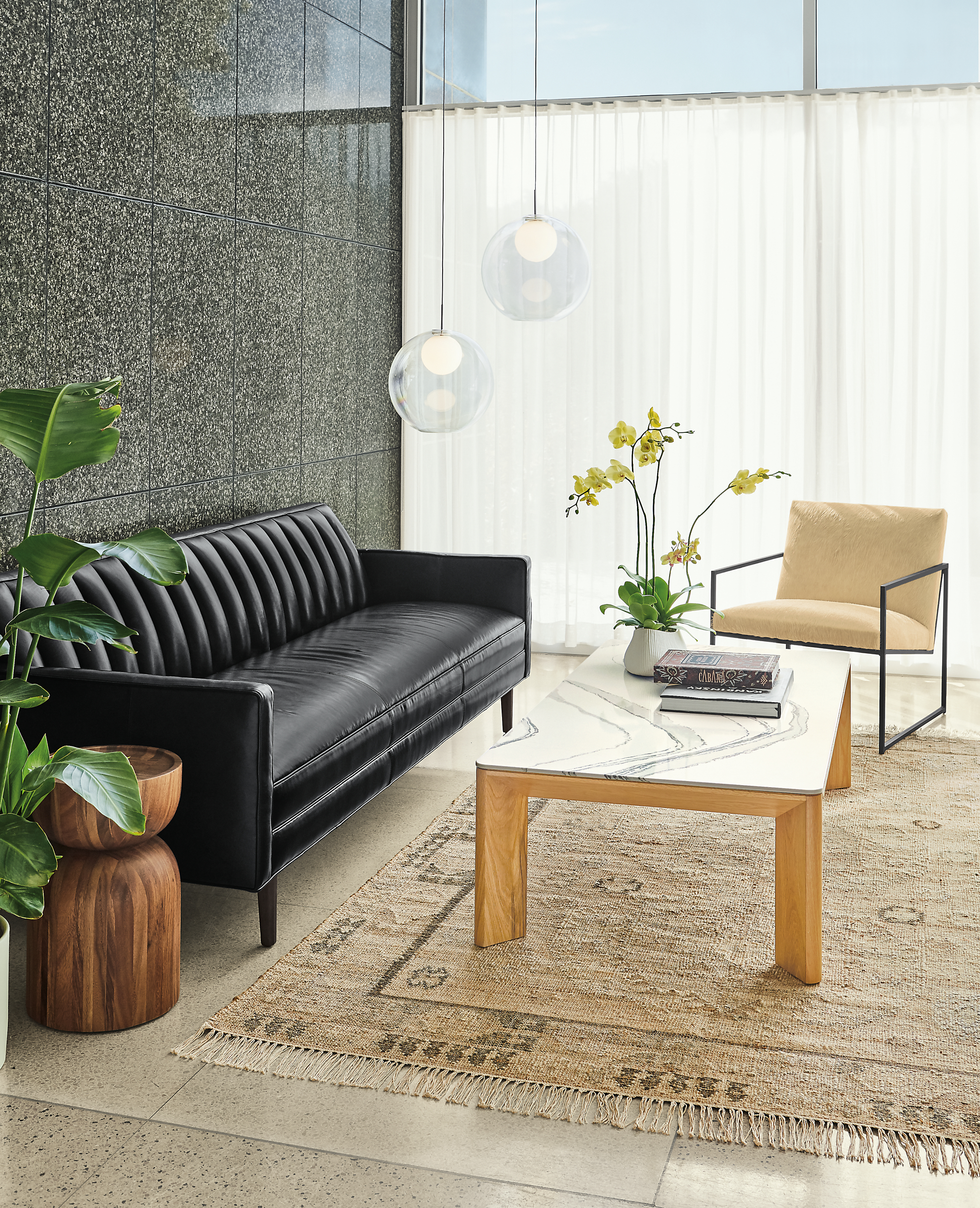 Detail of Goodwin sofa in Vento Black leather with Pren coffee table.