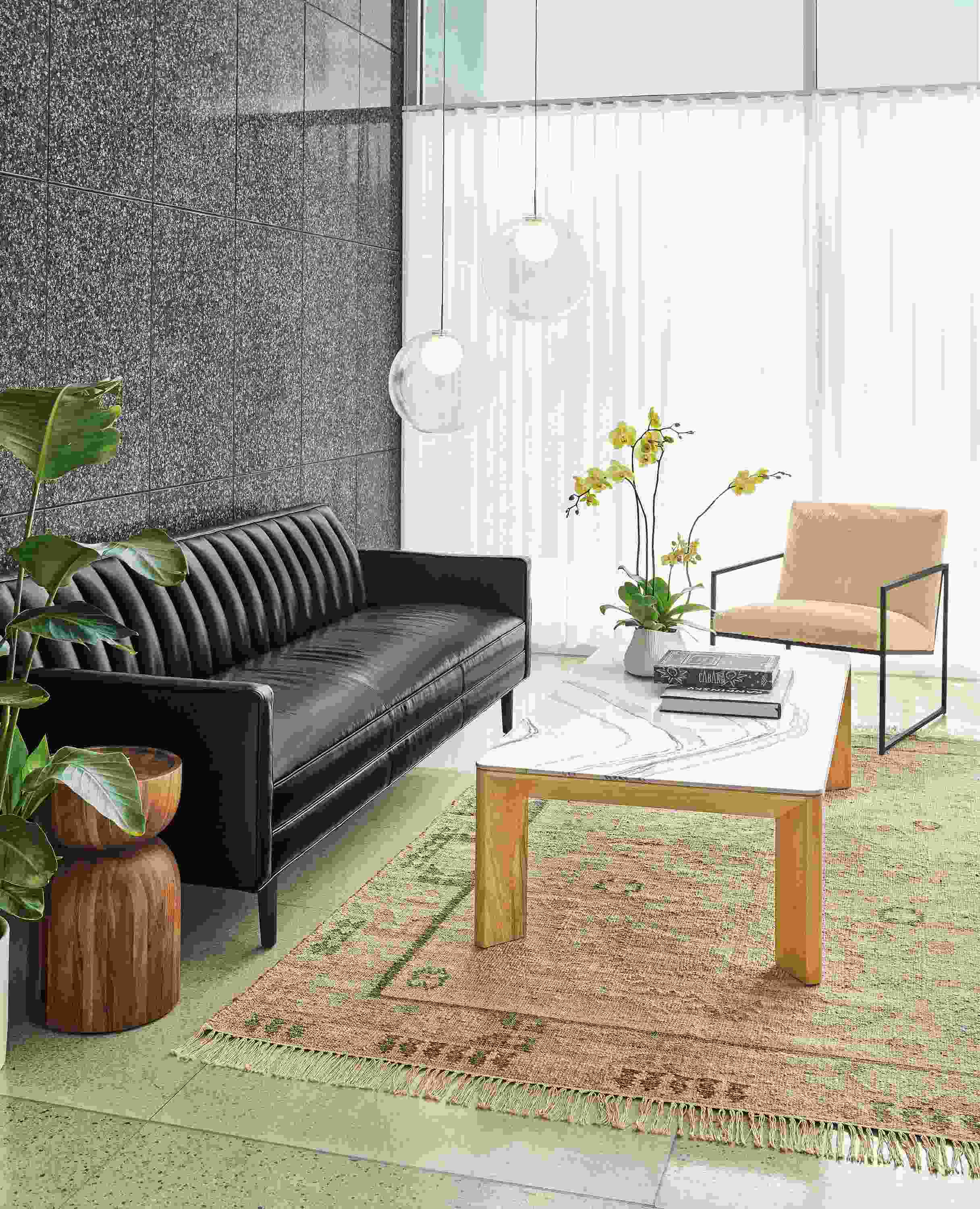 Detail of Goodwin sofa in Vento Black leather with Pren coffee table.