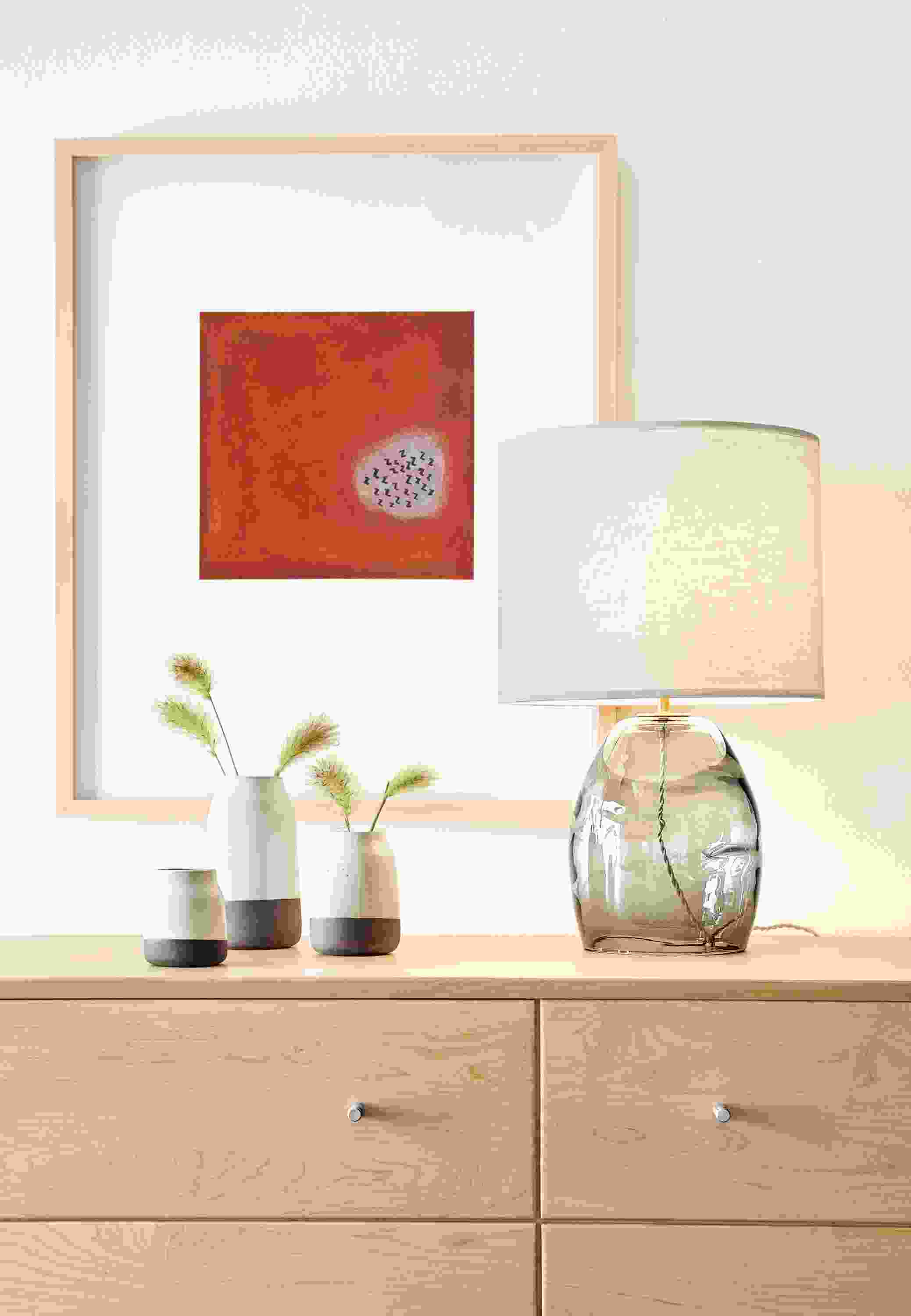Grace glass table lamp on dresser.