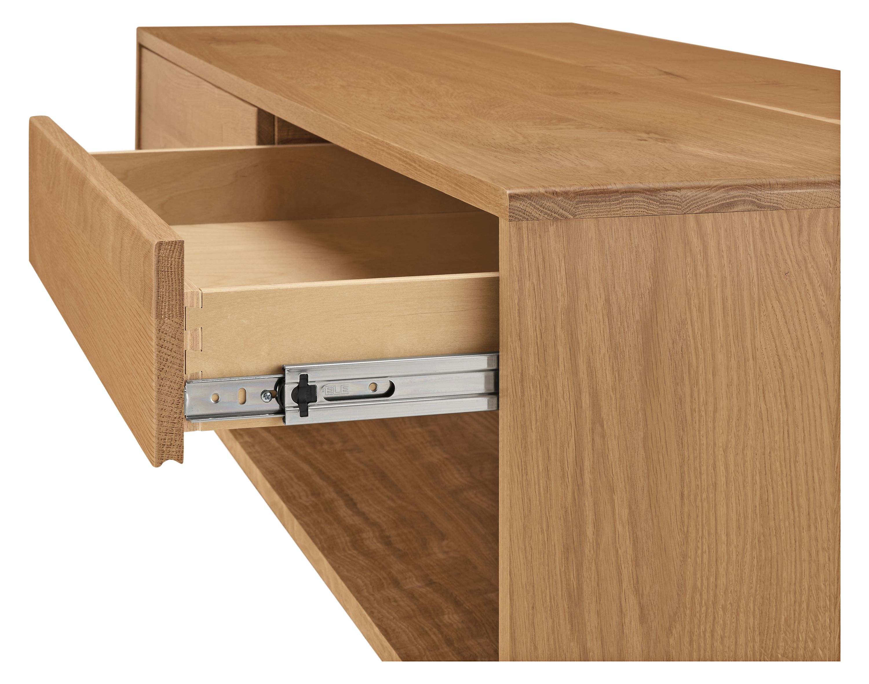 Graft 60-wide by 24 by 15-high coffee table in reclaimed white oak with open drawer showing drawer slide.