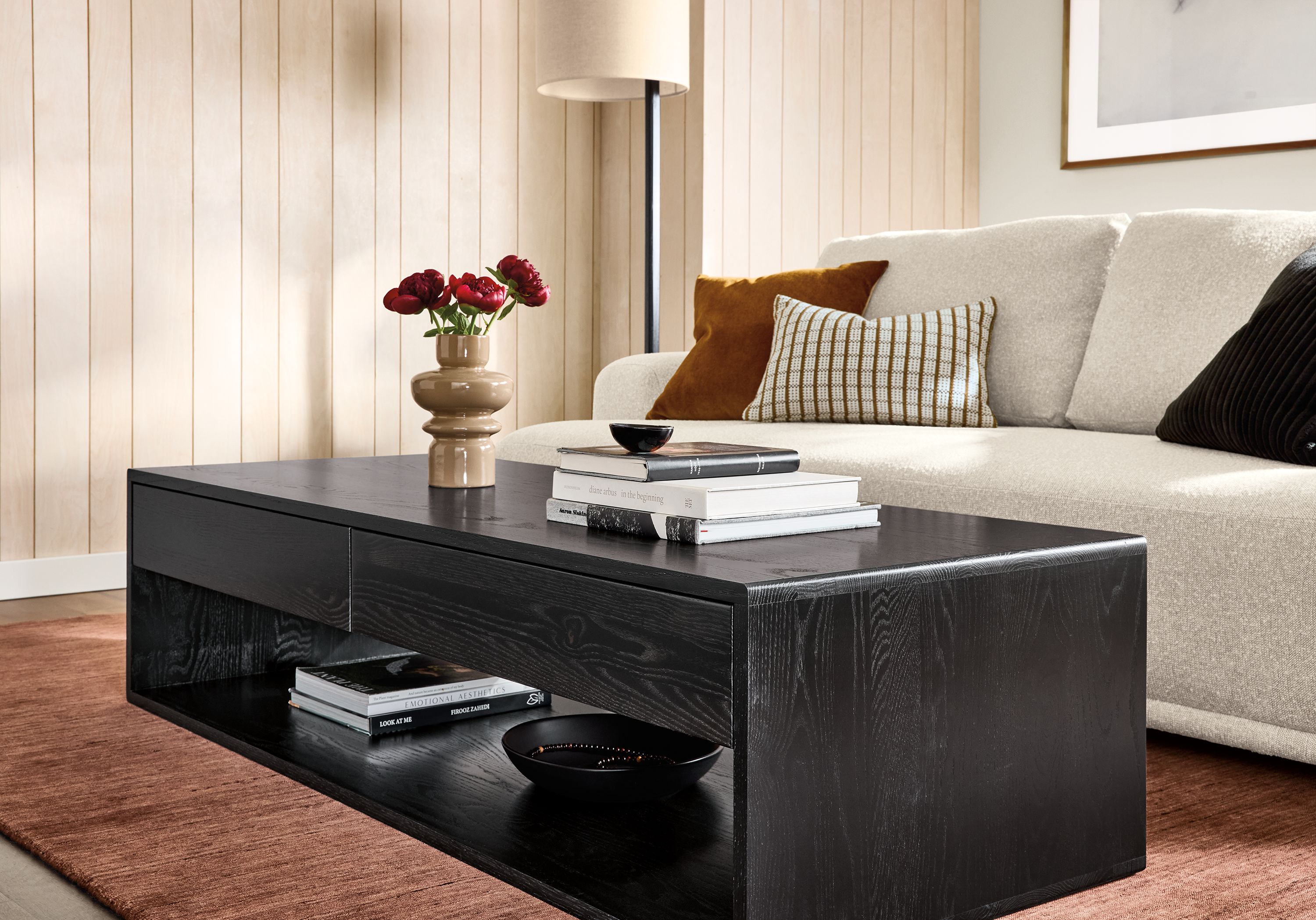 Living room with Graft coffee table in reclaimed oak with charcoal stain and Fia bench cushion sofa in conley natural.