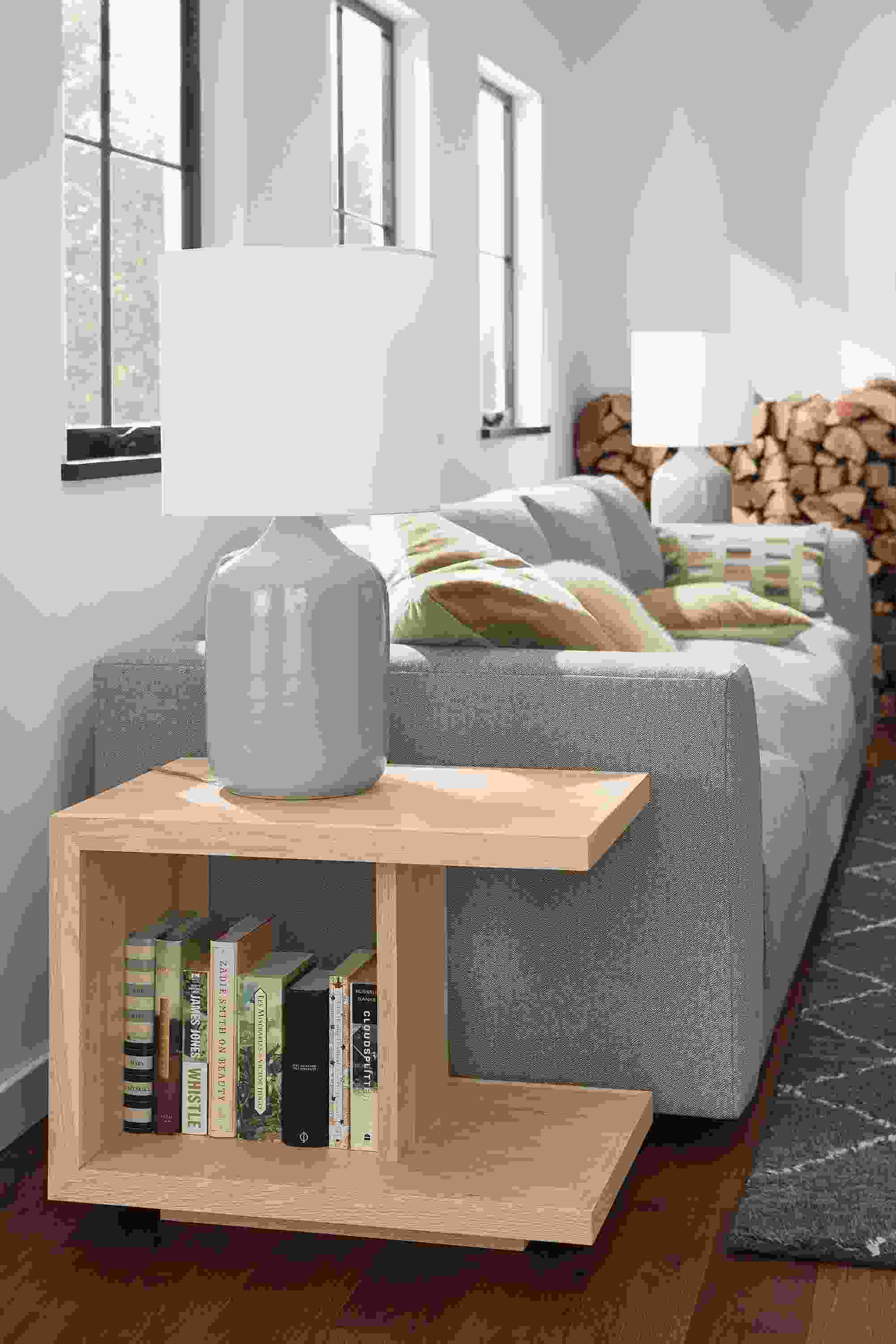 Living room with Graham end table in salt on red oak, Serena table lamp in grey and Clemens sofa in Hines Graphite.