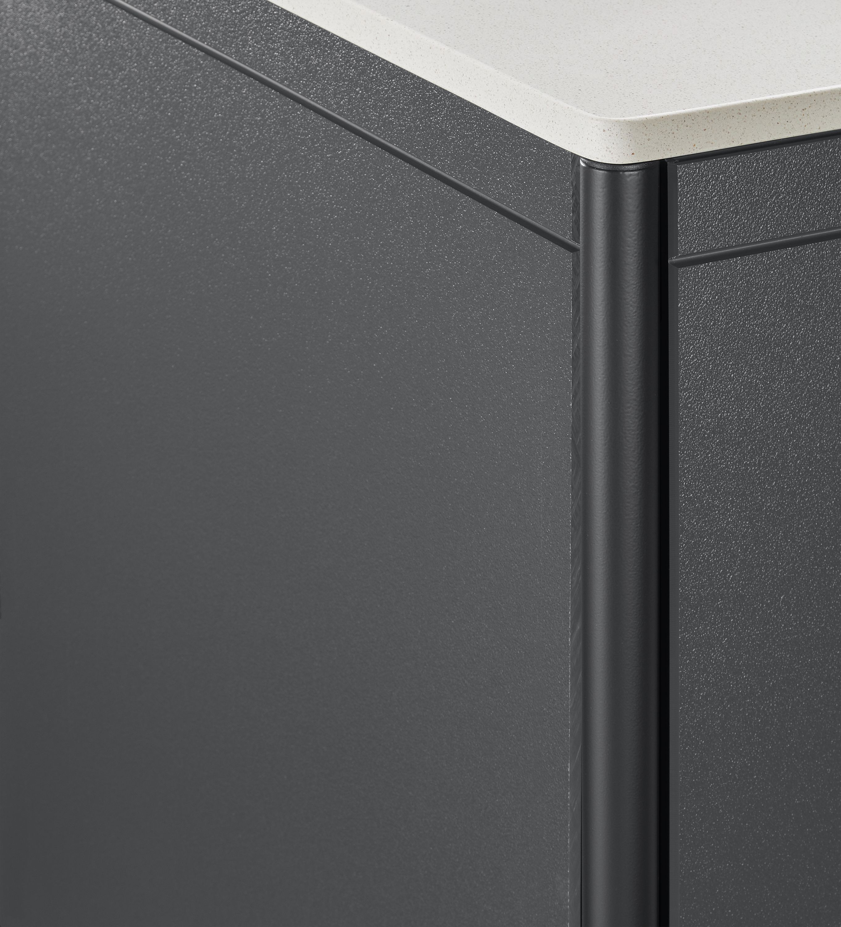 corner detail of Granger 28-wide Outdoor Cabinet with Metal Door Fridge and Stone Top.