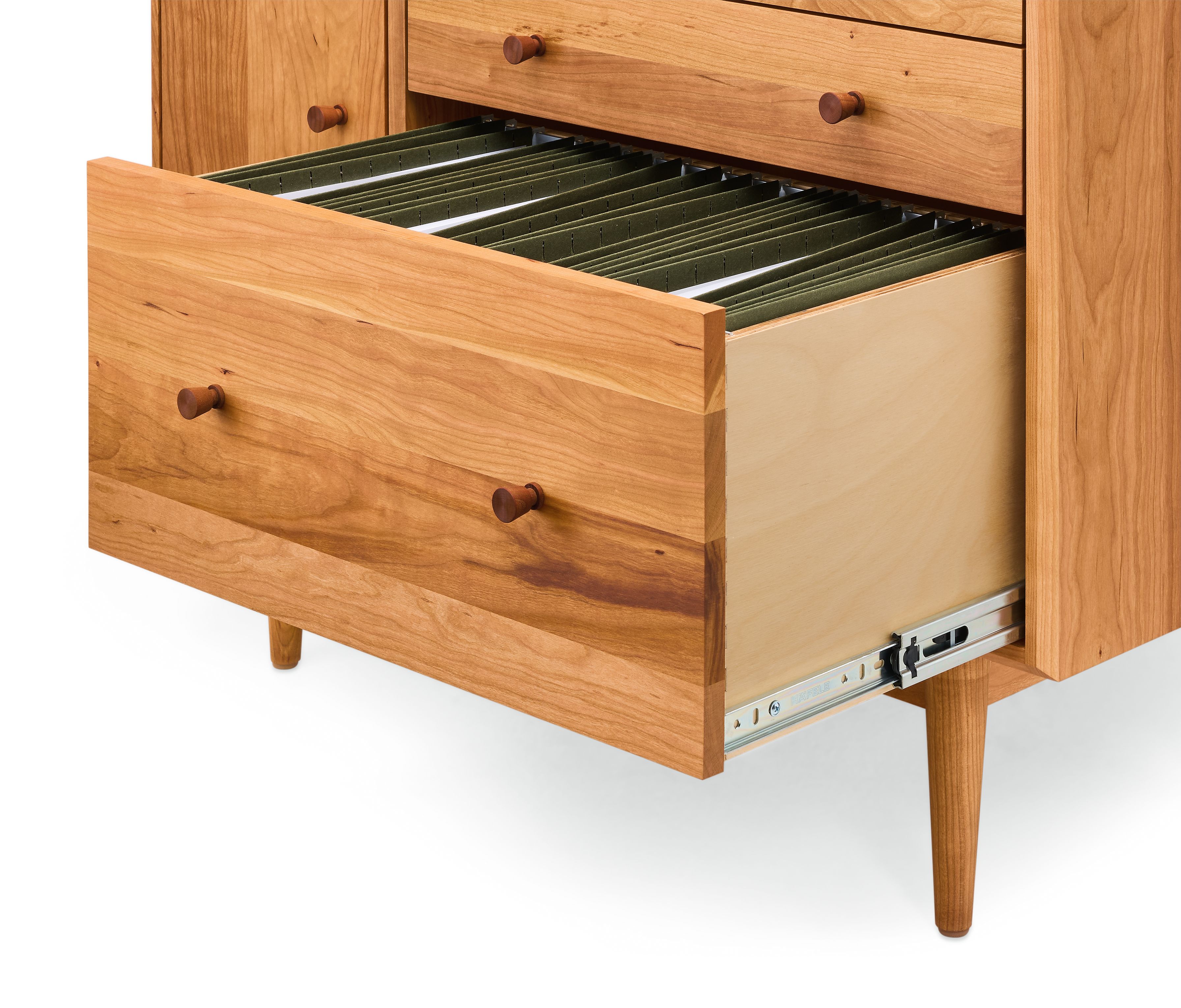 Detail of open drawer on a Grove 37-wide Office Armoire in Cherry showing letter size file folders.