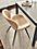 Detail of 1 Gwen synthetic leather side chair in Buff at Parsons table.