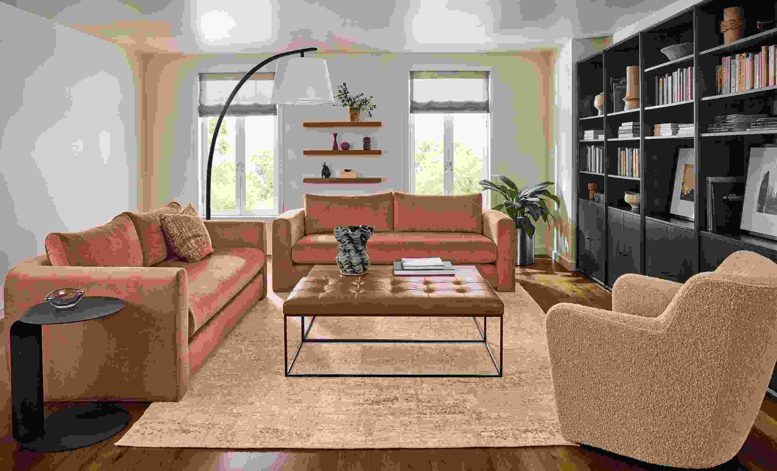 Living room with 2 Hannah bench cushion sofas in Windsor clay and Lily chair in Dornick Camel.