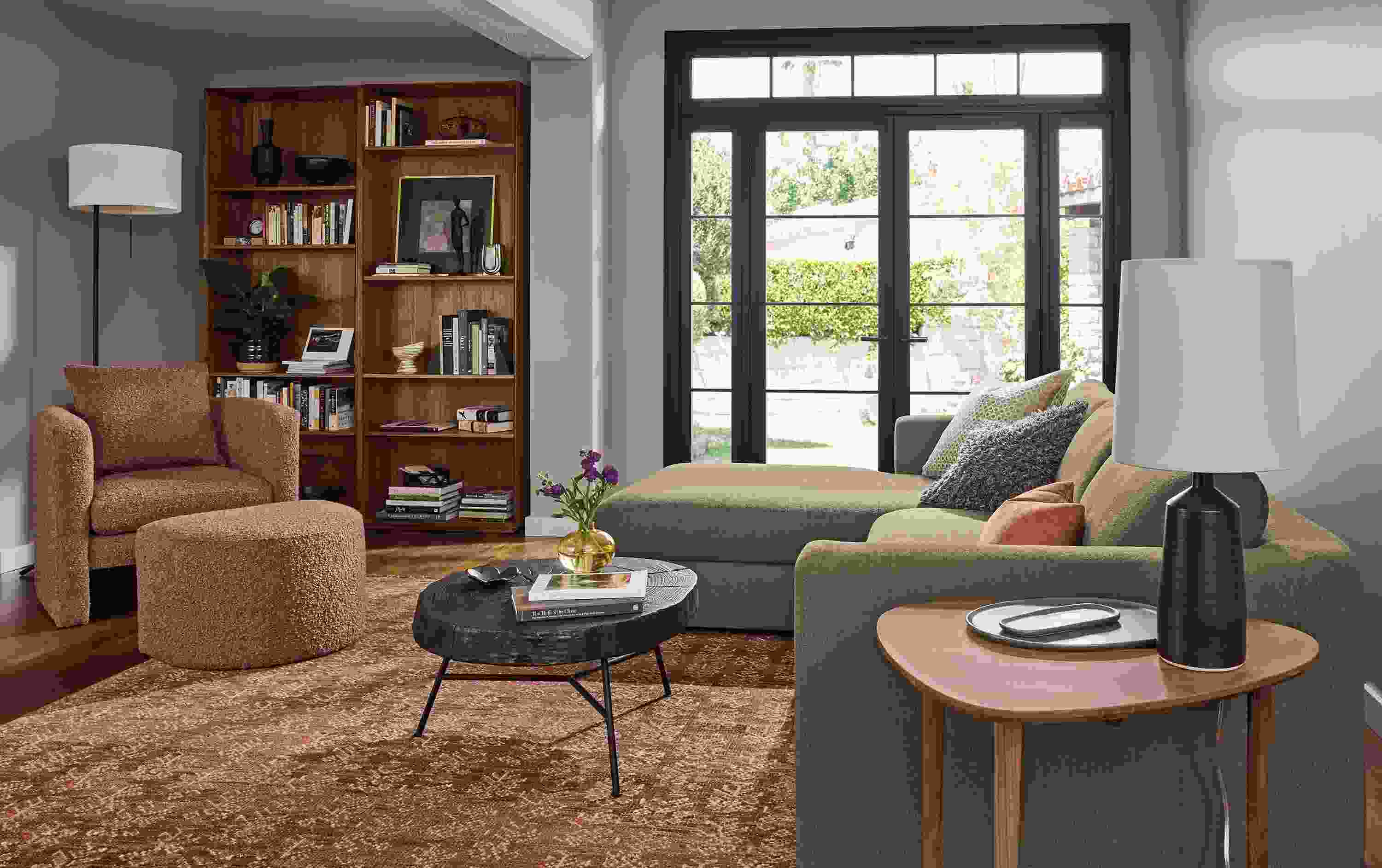 Living room with Hannah 107-wide sofa in Dusk Mink and Silva chair and ottoman in Dornick Claystone.
