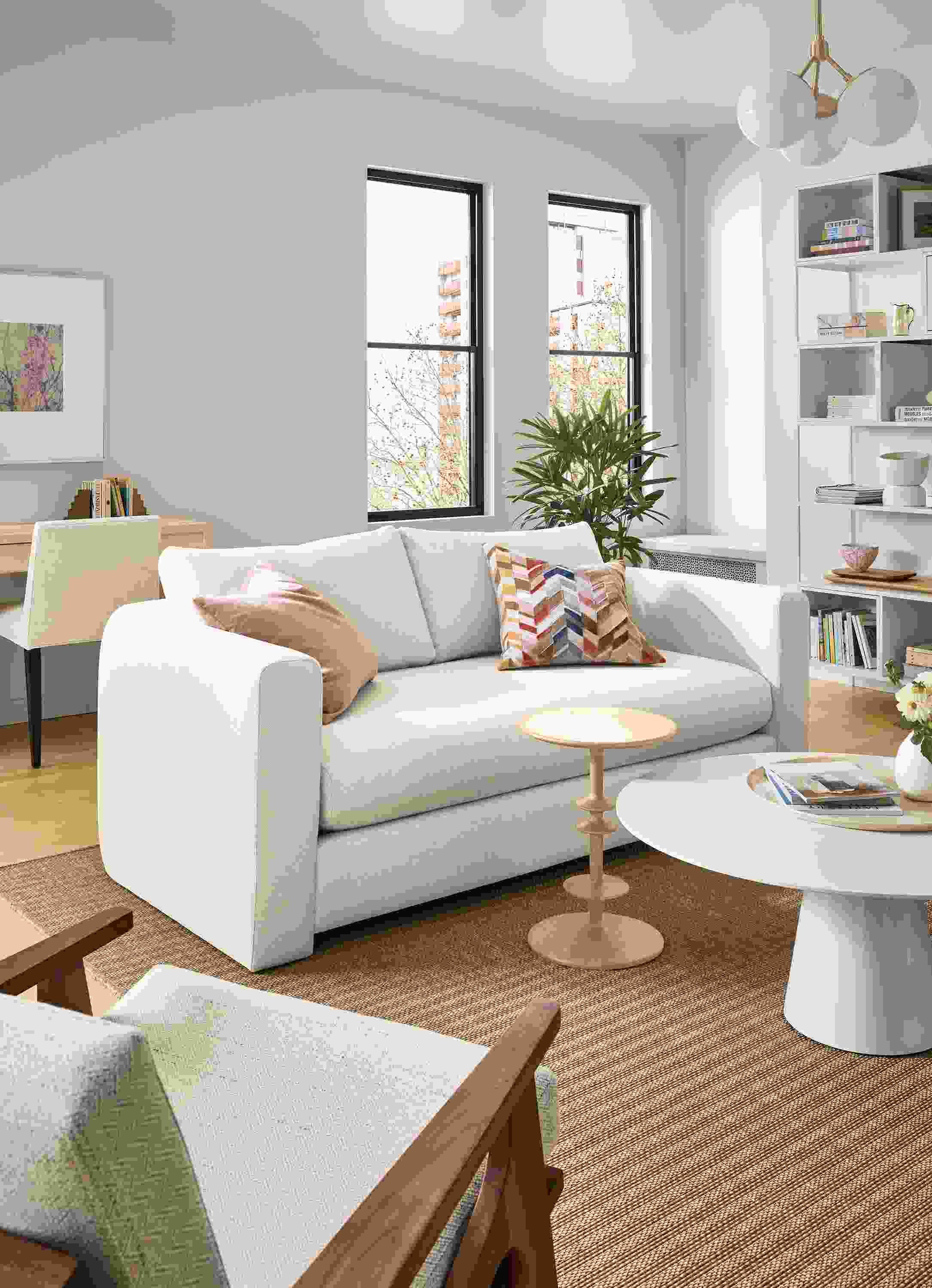 Living room with Hannah 76-wide bench cushion sofa in sumner ivory, decker coffee table in white and parks end table in white oak.