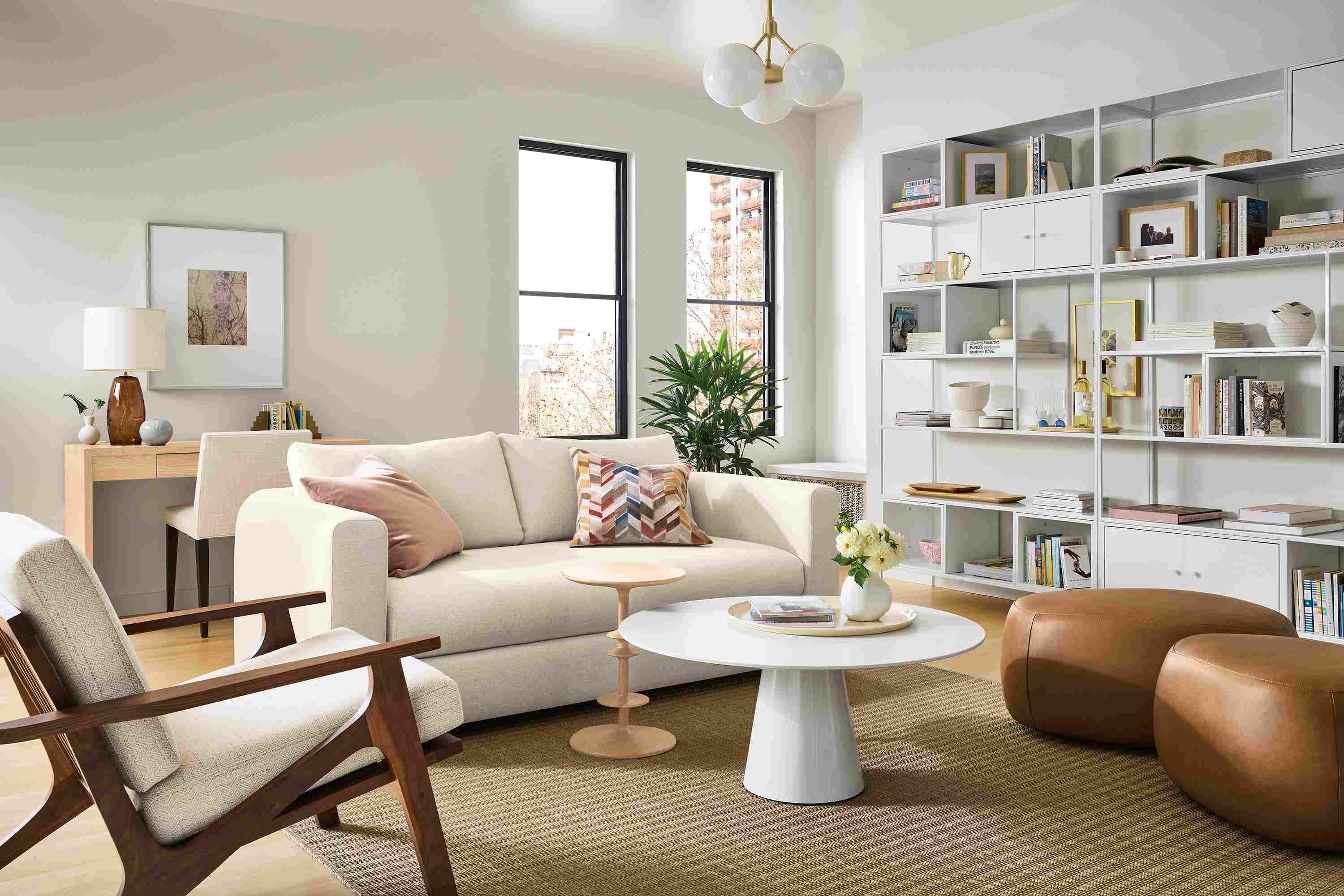Living room with Hannah 76-wide bench cushion sofa in sumner ivory, sanna chair in Kinsey oatmeal and leland rug in sand.
