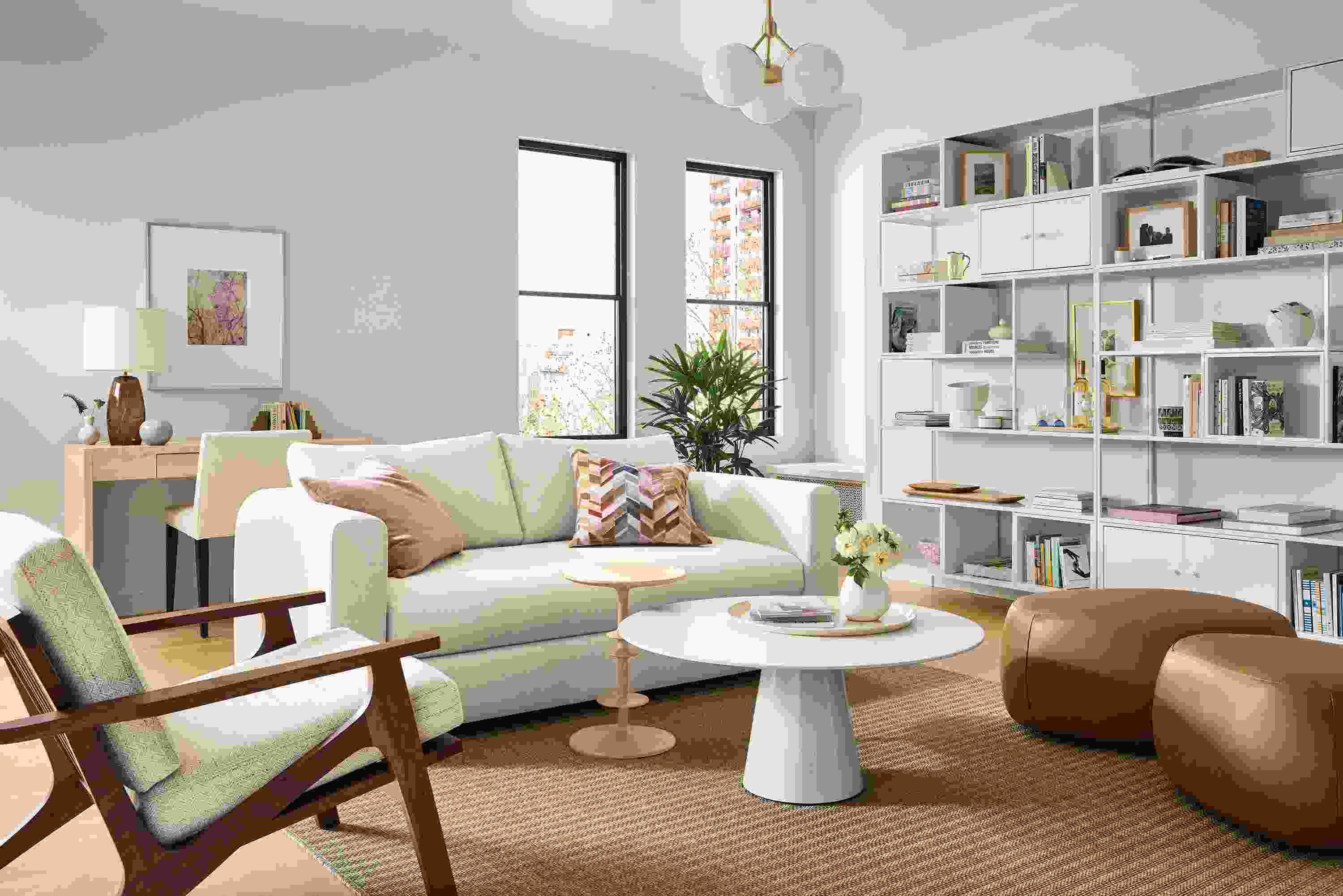 Living room with Hannah 76-wide bench cushion sofa in sumner ivory, sanna chair in Kinsey oatmeal and leland rug in sand.