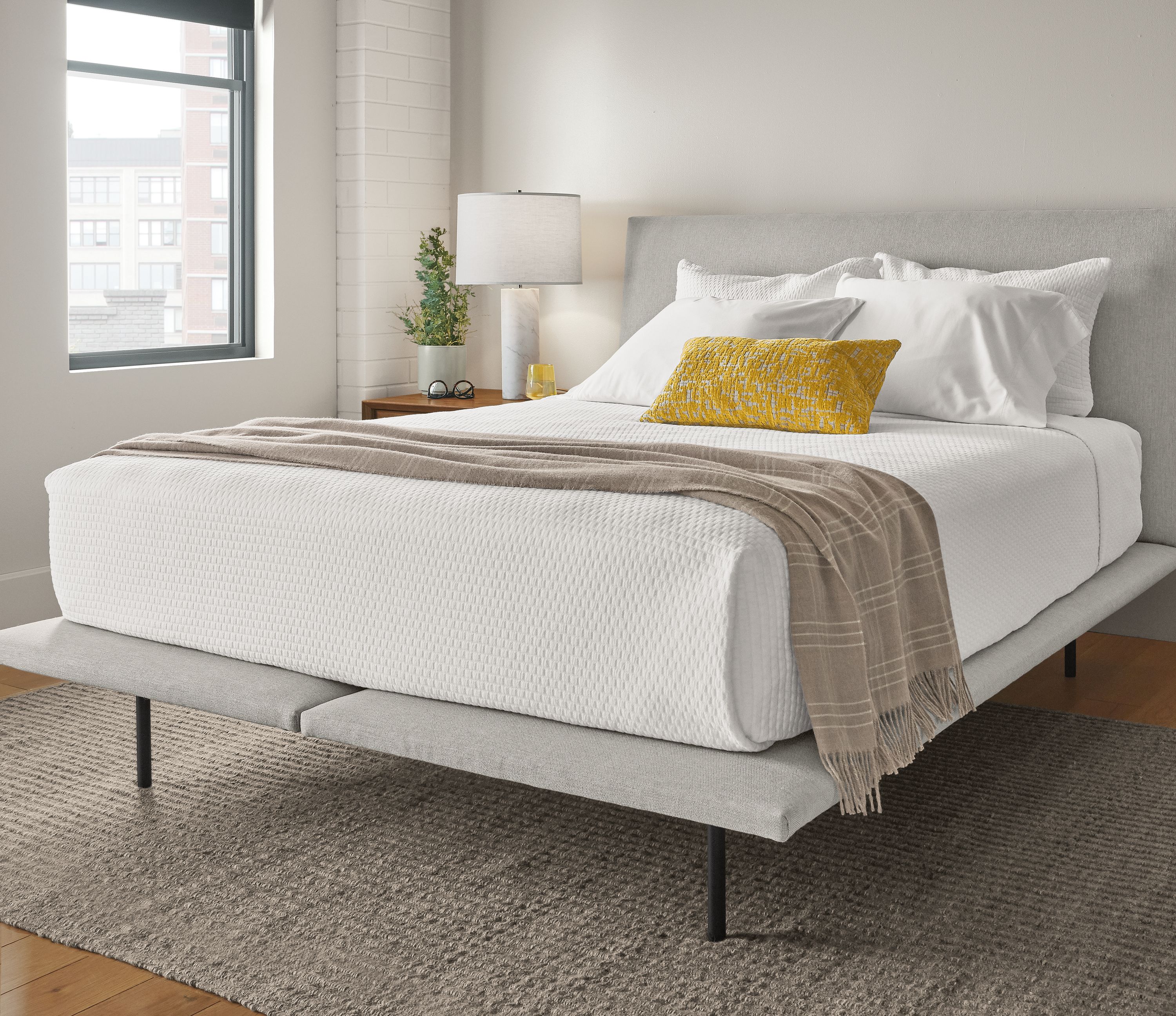 Close detail of Hanson upholstered bed.