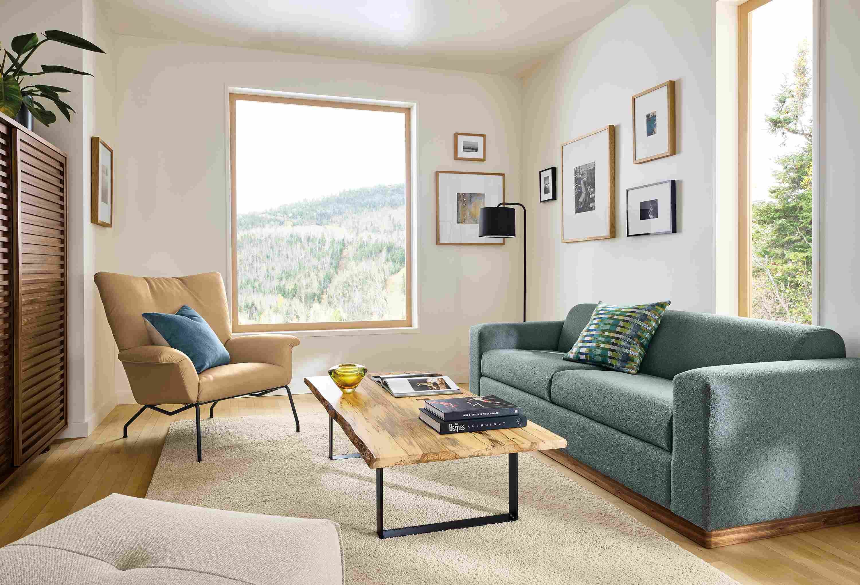 Living room with Harmon sofa in Declan Haze, Paris chair in Fiero camel leather and Chilton spalted sugarberry table.