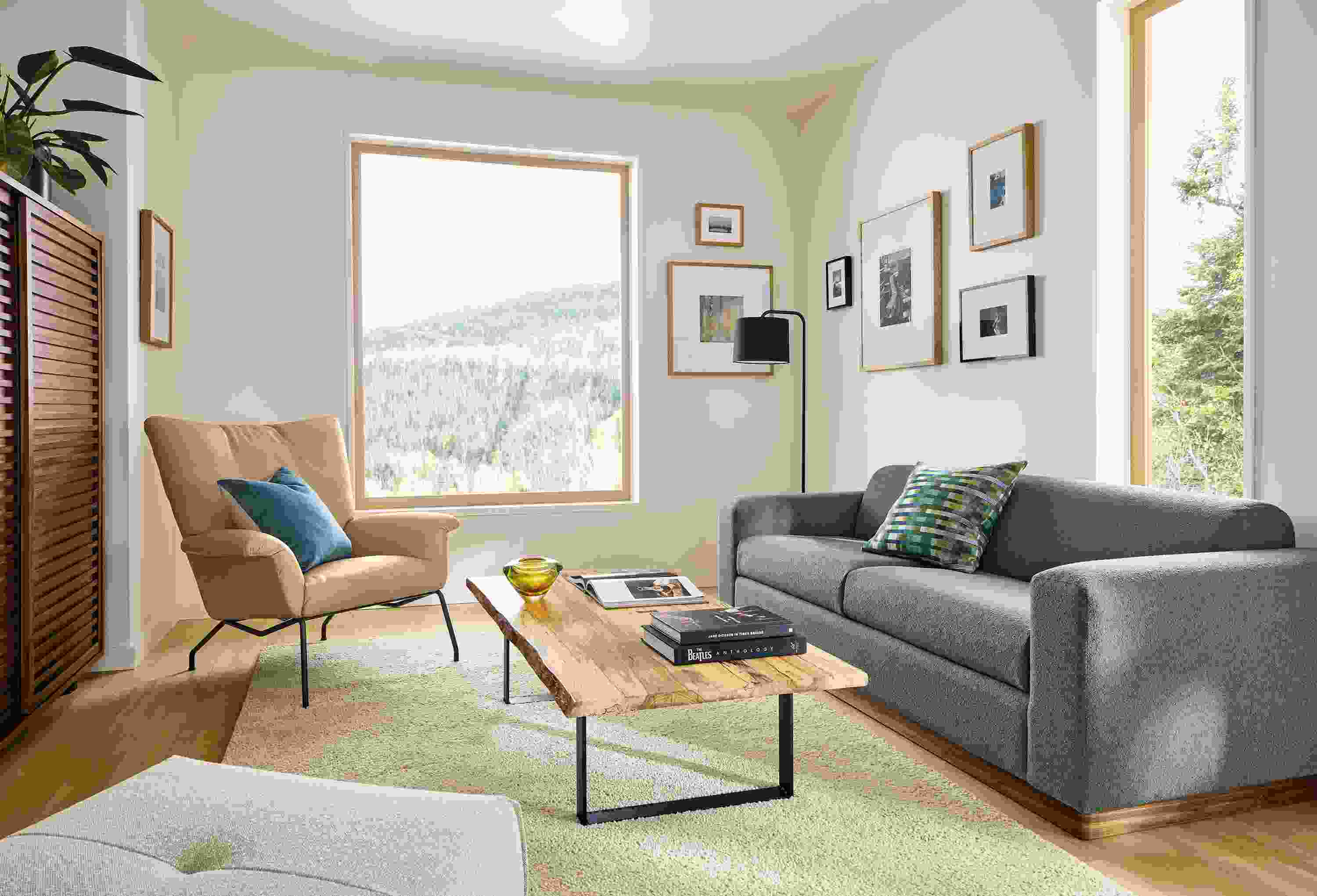 Living room with Harmon sofa in Declan Haze, Paris chair in Fiero camel leather and Chilton spalted sugarberry table.