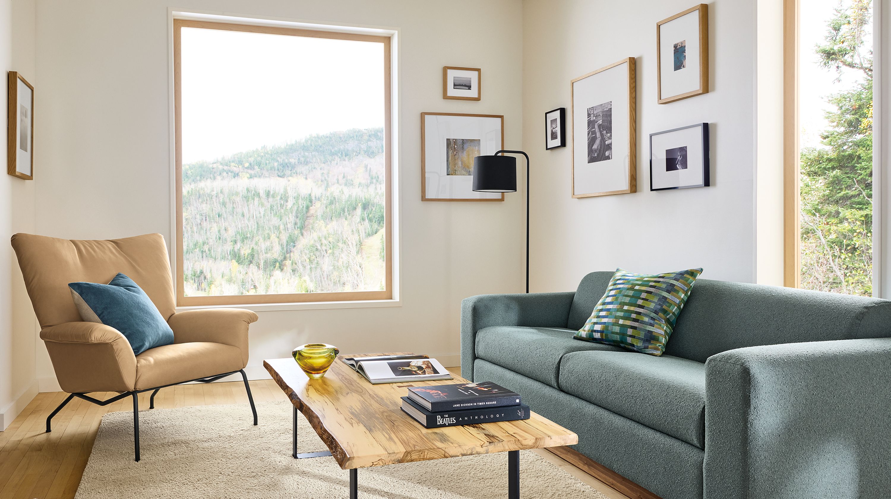 Living room with Harmon sofa in Declan Haze, Paris chair in Fiero camel leather and Chilton spalted sugarberry table.