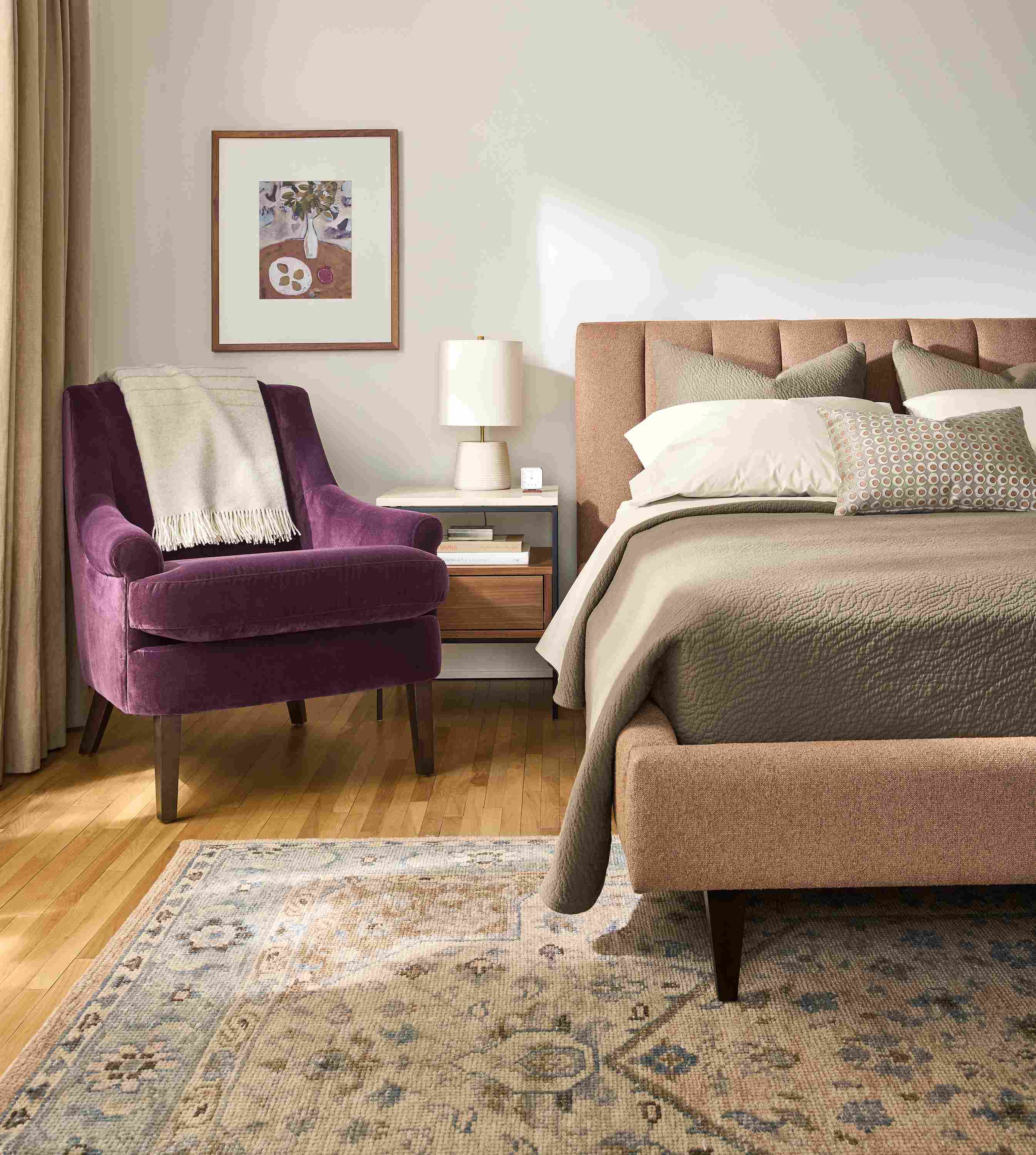 Bedroom with Hartley Queen bed in Declan Sienna, Louise Chair in Redding Plum and Veda 6 by 9 rug in Camel.