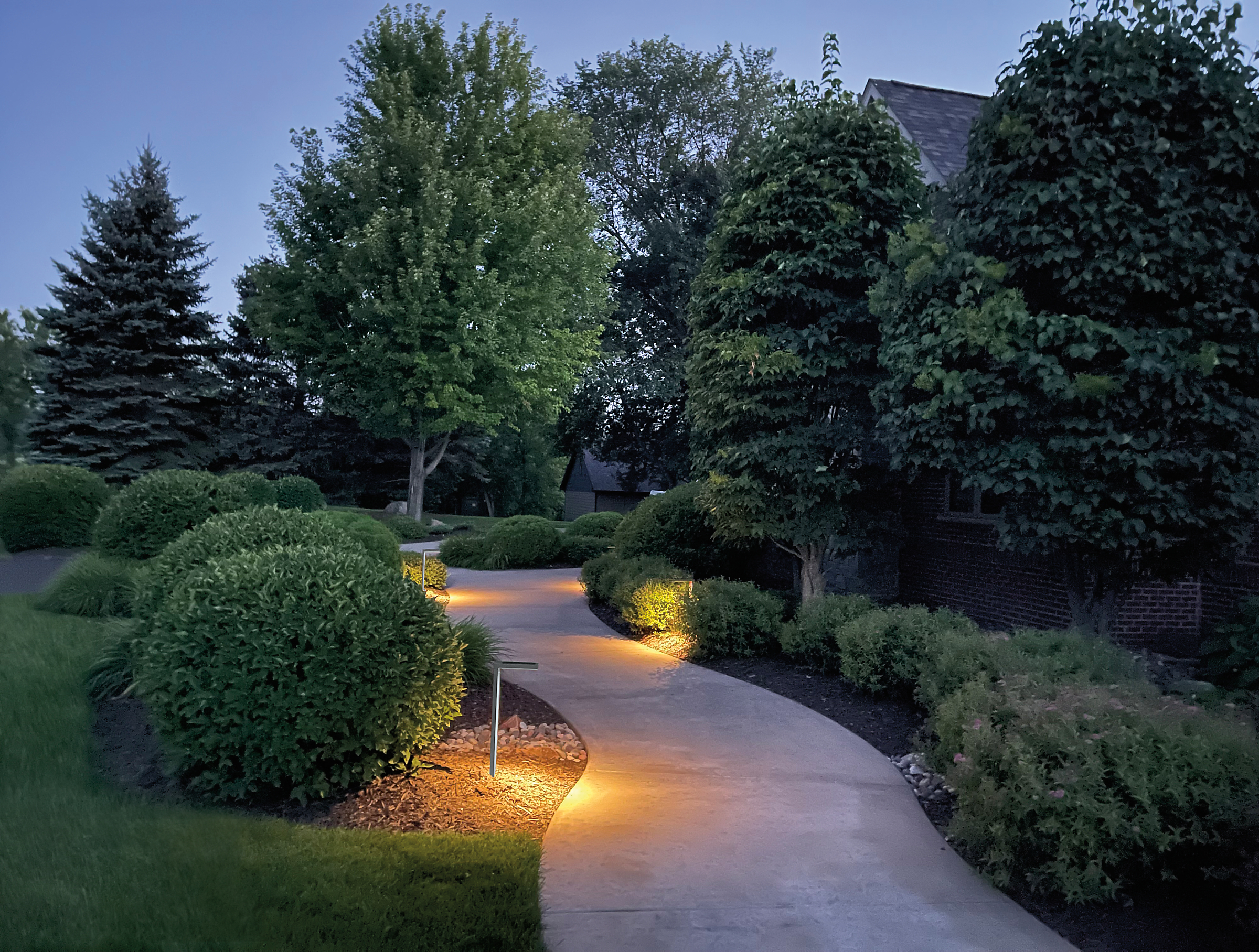 outdoor winding sideway with Harvey Solar Light in Grey at dusk.