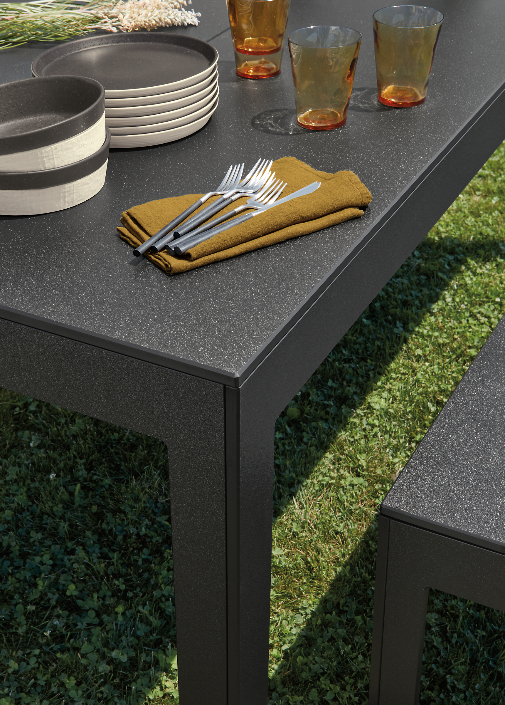 Closeup of Henry outdoor table and bench in black recycled HDPE.