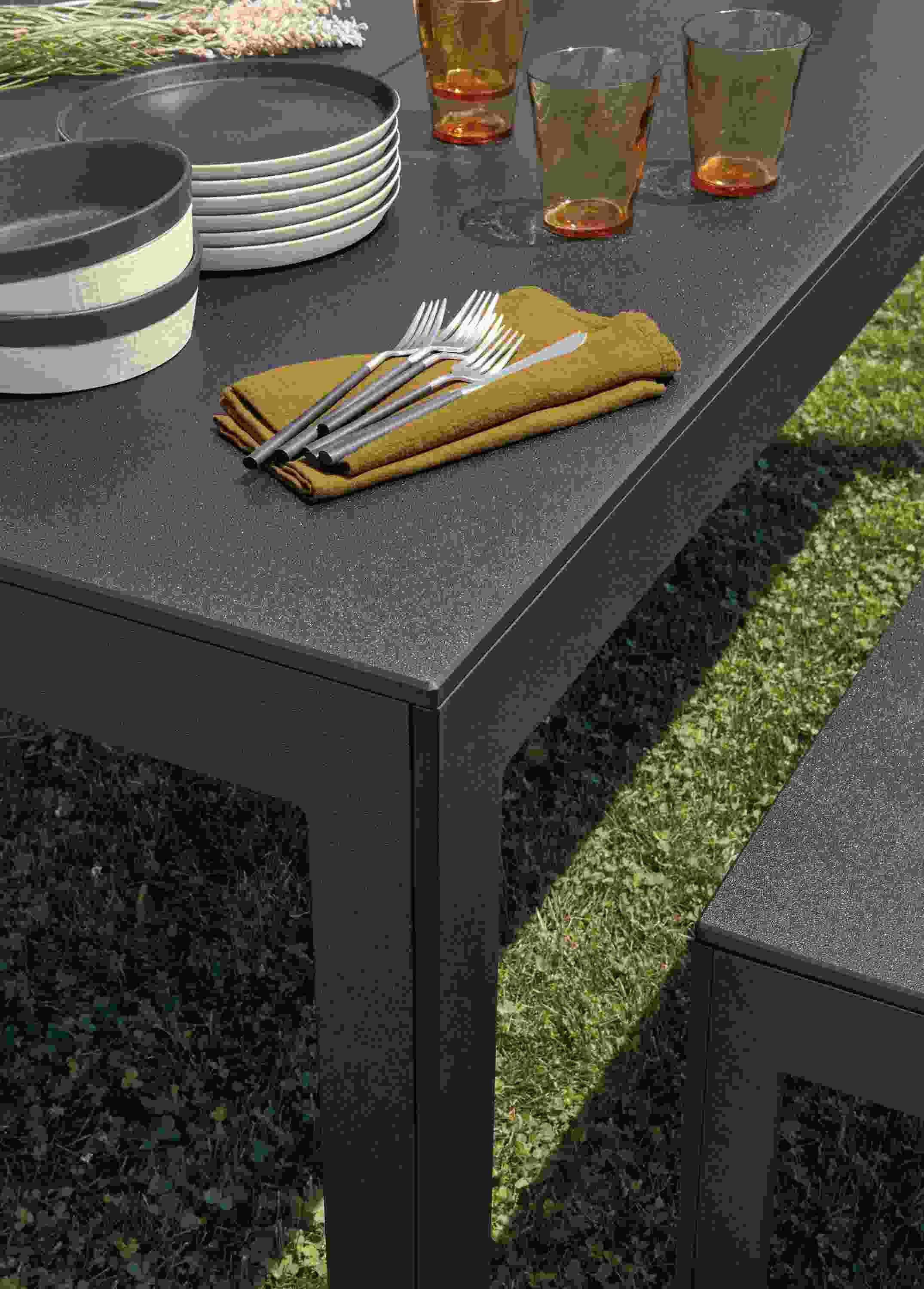 Closeup of Henry outdoor table and bench in black recycled HDPE.