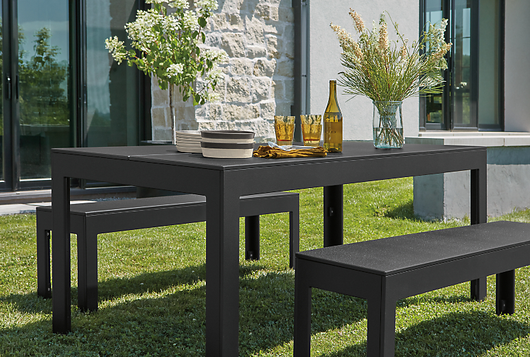 Henry outdoor table and bench seats in black recycled HDPE.