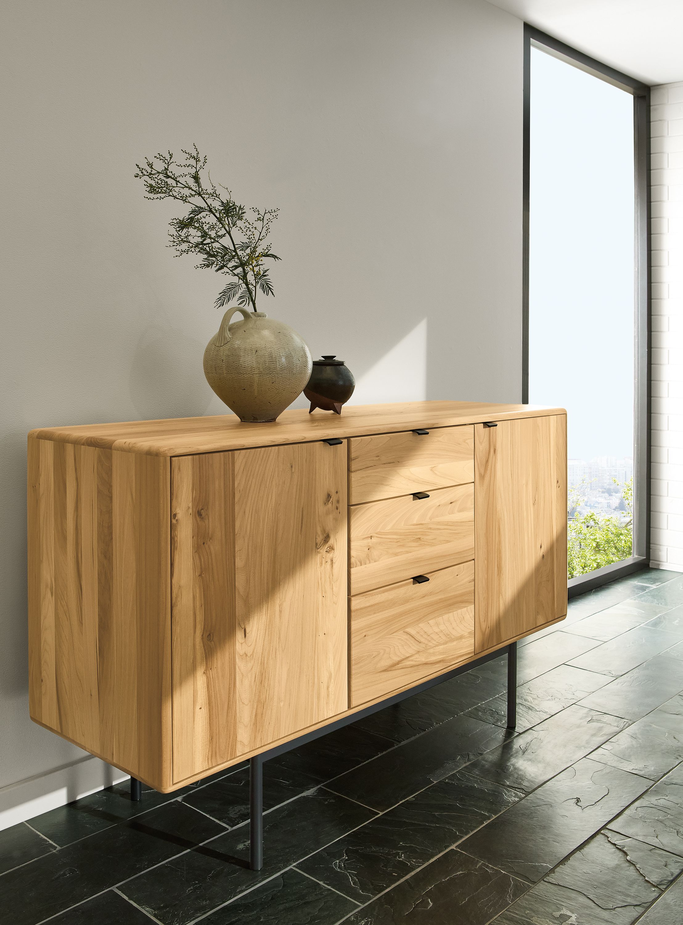 Sunny entryway with Hensley 60-wide storage cabinet in reclaimed elm and graphite.