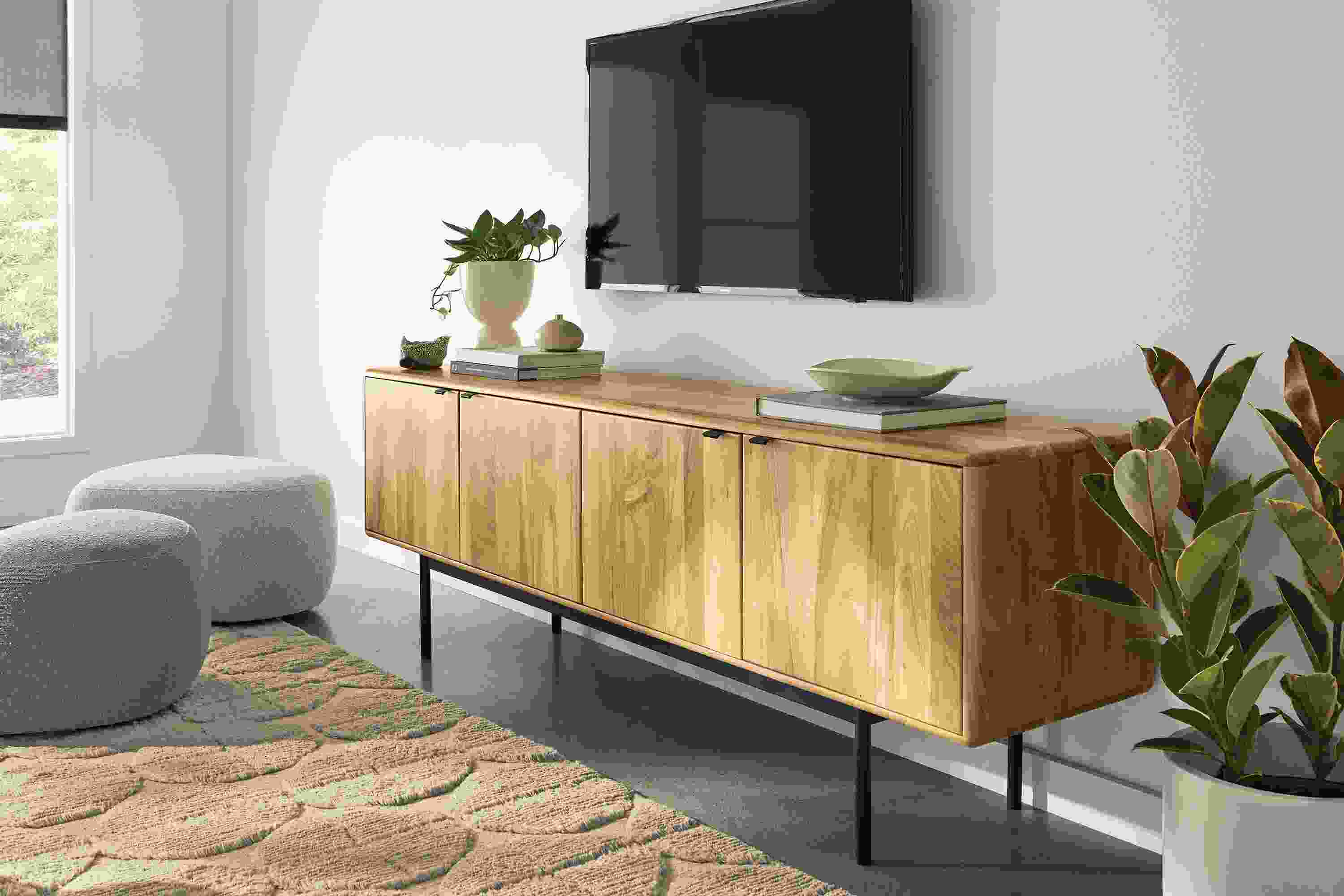 Living room with Hensley 80-wide media cabinet in reclaimed elm and Asher ottomans in Declan Putty and Declan Natural.