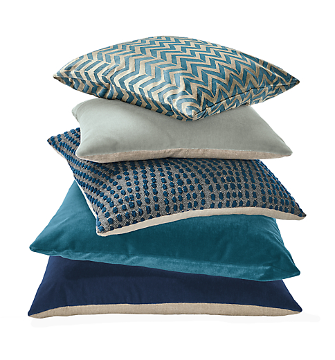 Detail stack of throw pillows in royal.