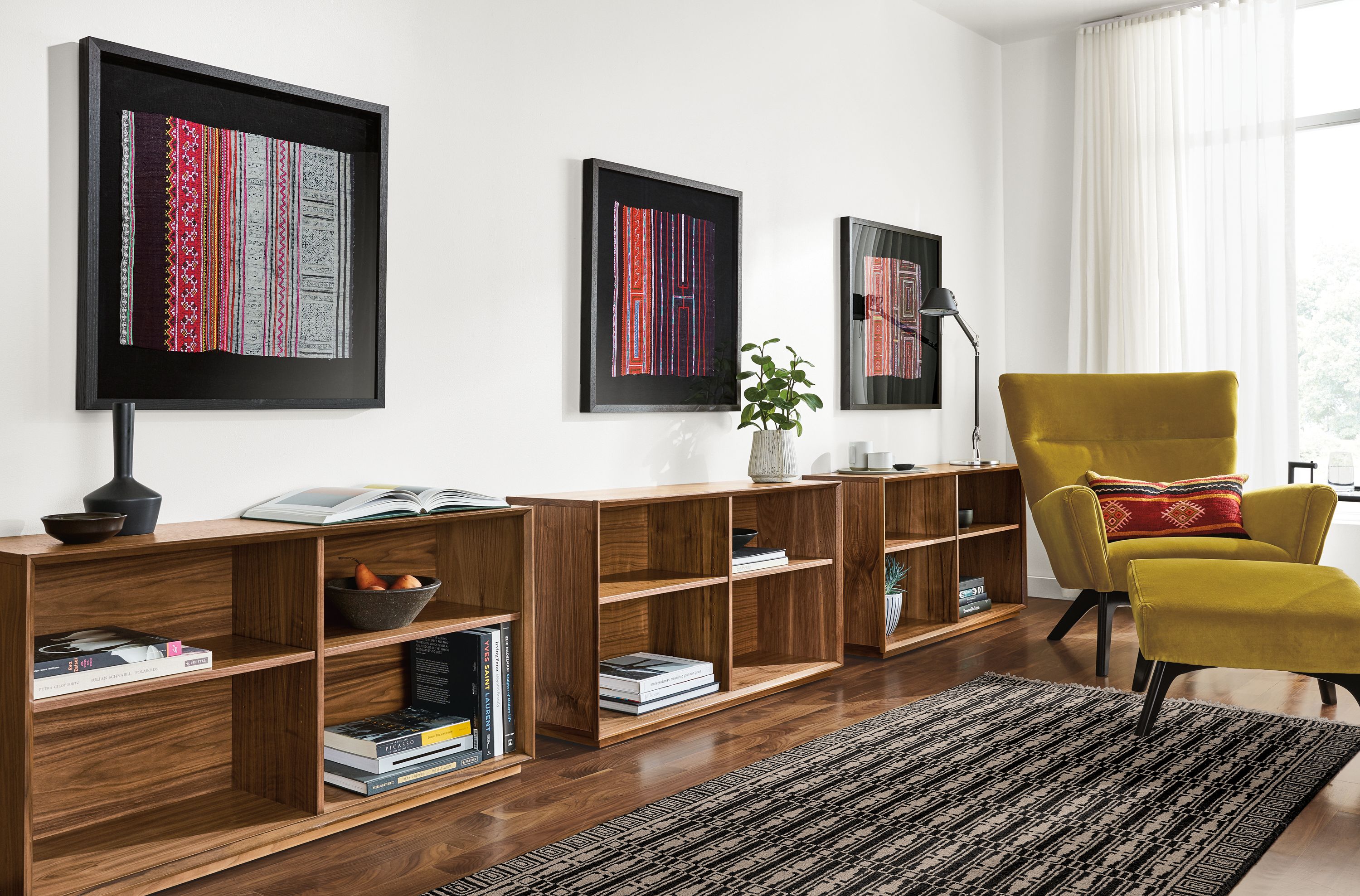 Detail of framed vintage Hmong textiles.