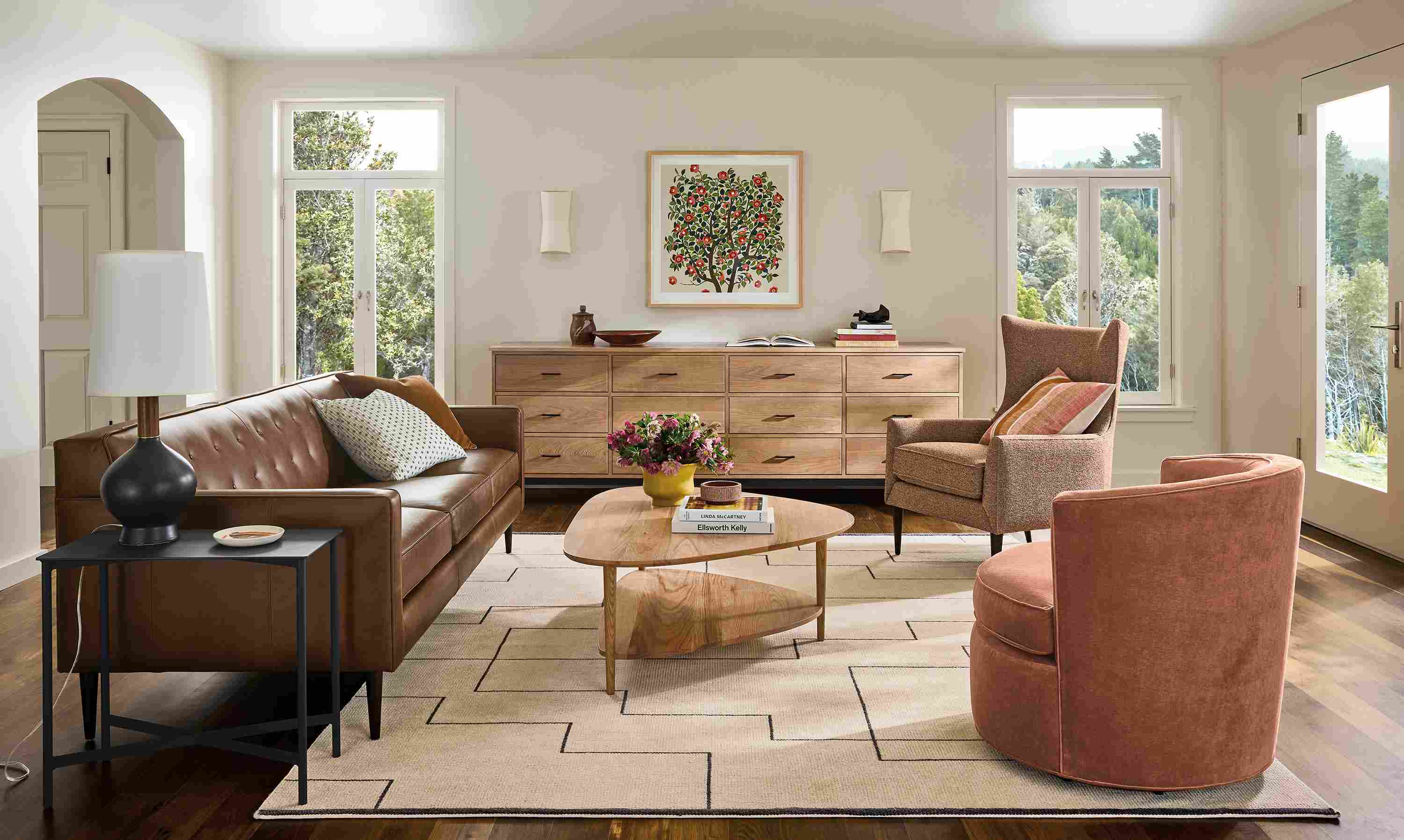 Living room with Holmes 89-wide sofa in Palermo Bourbon, Gibson coffee table in rye on red oak and Navi rug in Ivory/Black.