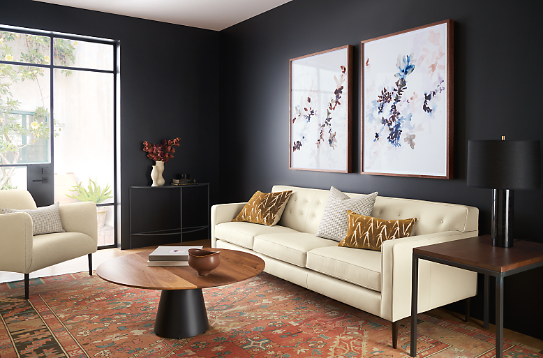 living room with holmes leather sofa, jen garrido artwork, decker coffee table, kayseri rug.