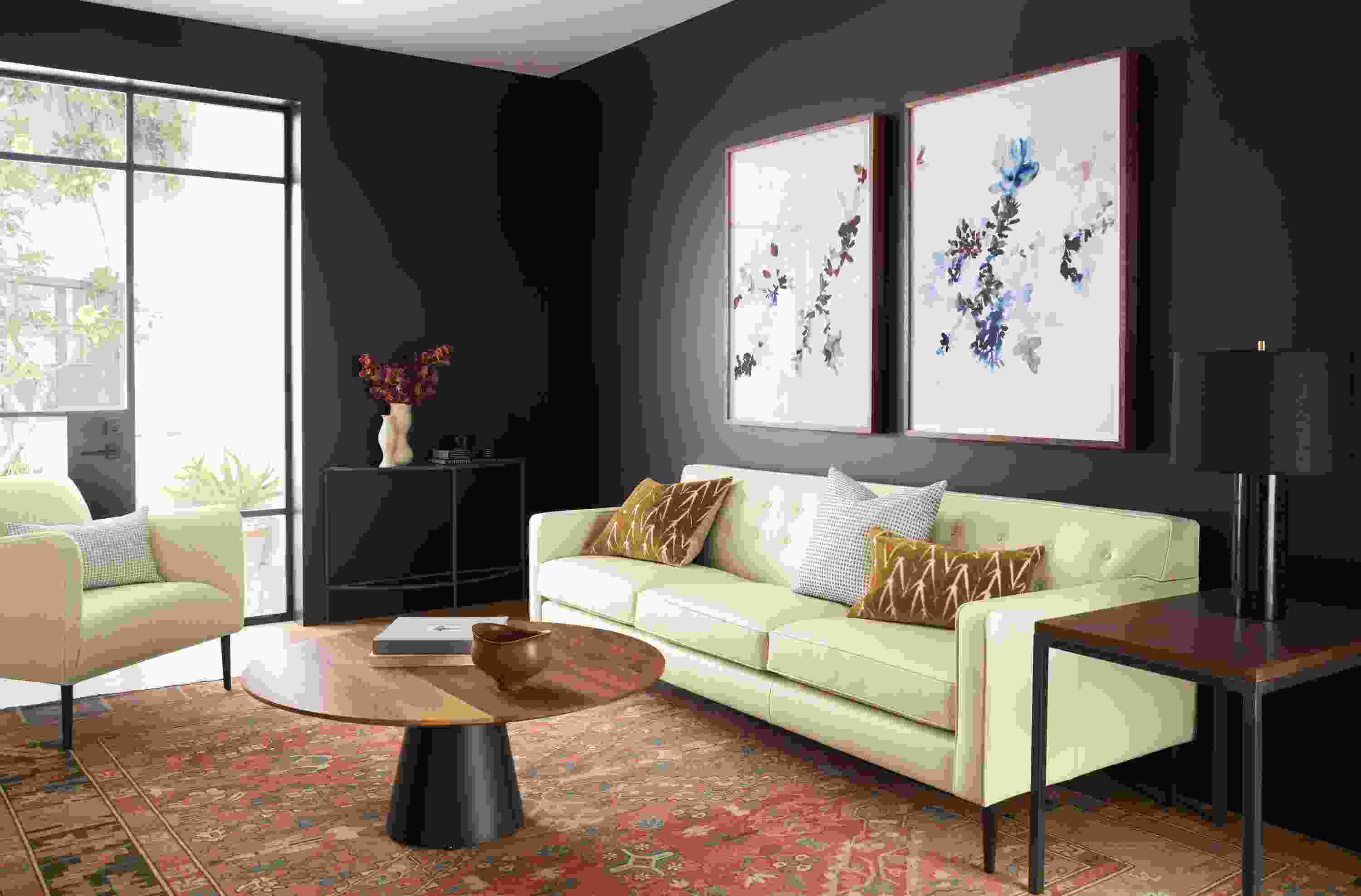 living room with holmes leather sofa, jen garrido artwork, decker coffee table, kayseri rug.