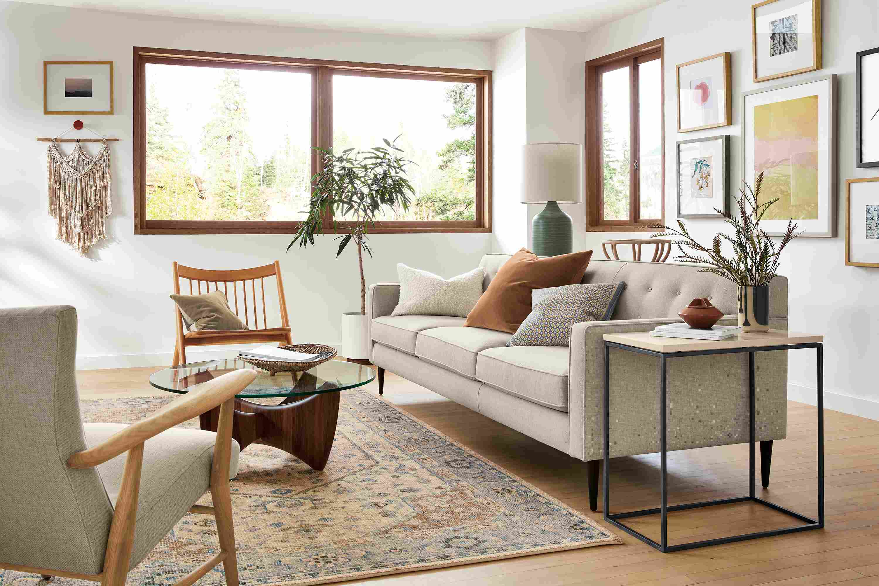 Living room with Holmes sofa and Jonas lounge chair both in sumner linen and Veda 6 by 9 rug in Camel.