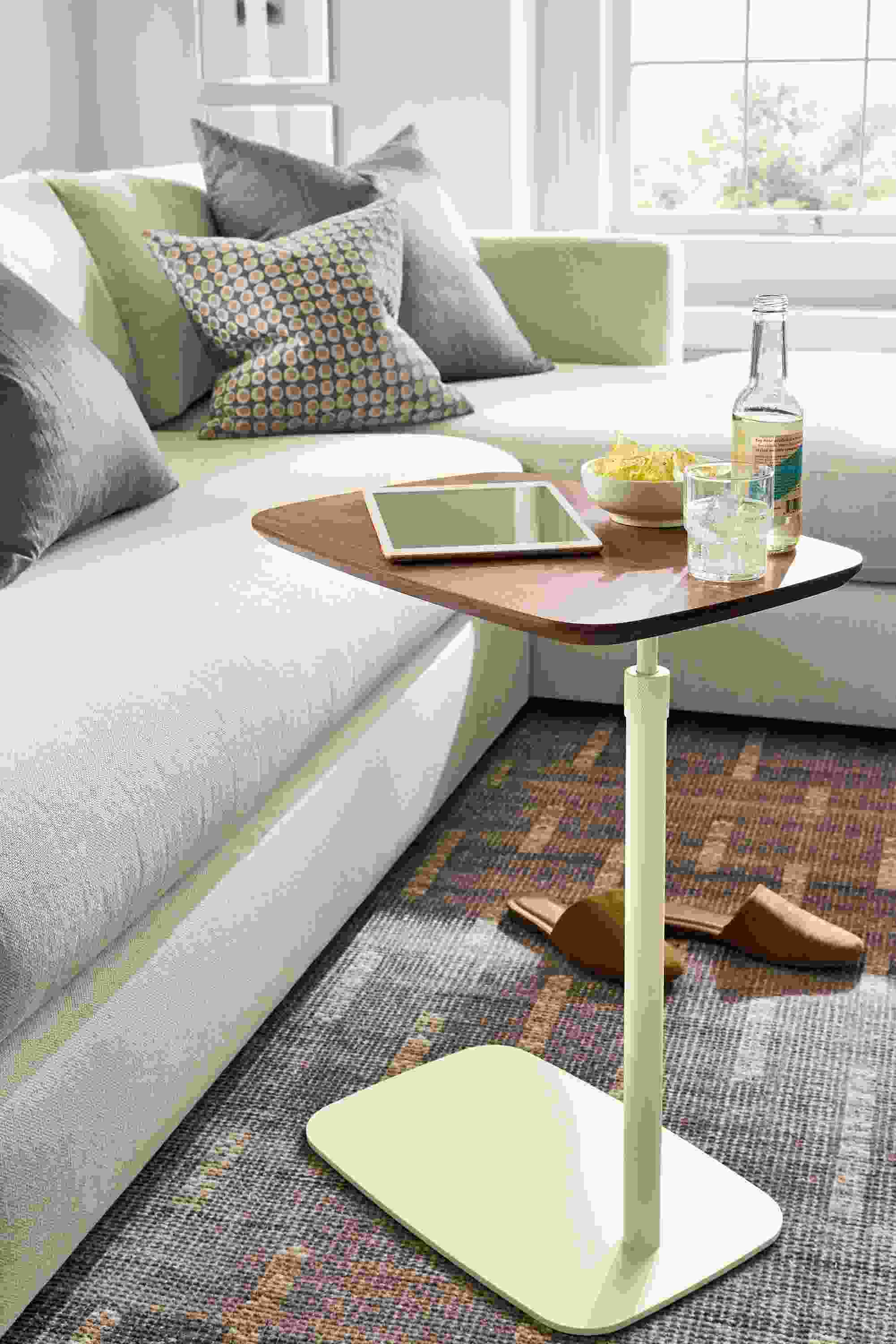 Living room with Hopper c-table in bisque and walnut, Hannah sofa in Sumner Ivory and Baran rug in grey.