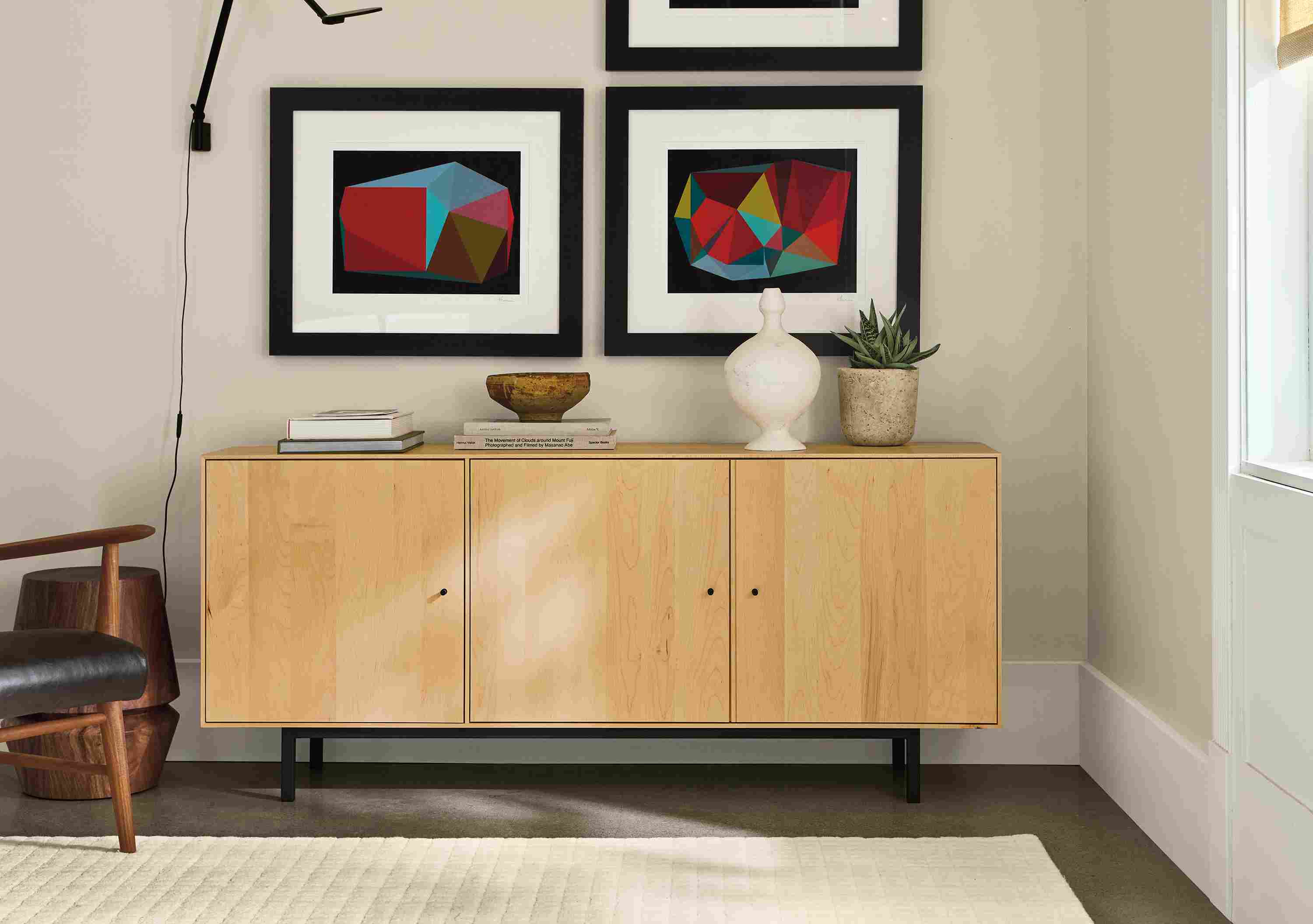 Room with Hudson custom 65-wide cabinet in maple, Safira rug in ivory and  3 Boissiere artwork pieces.
