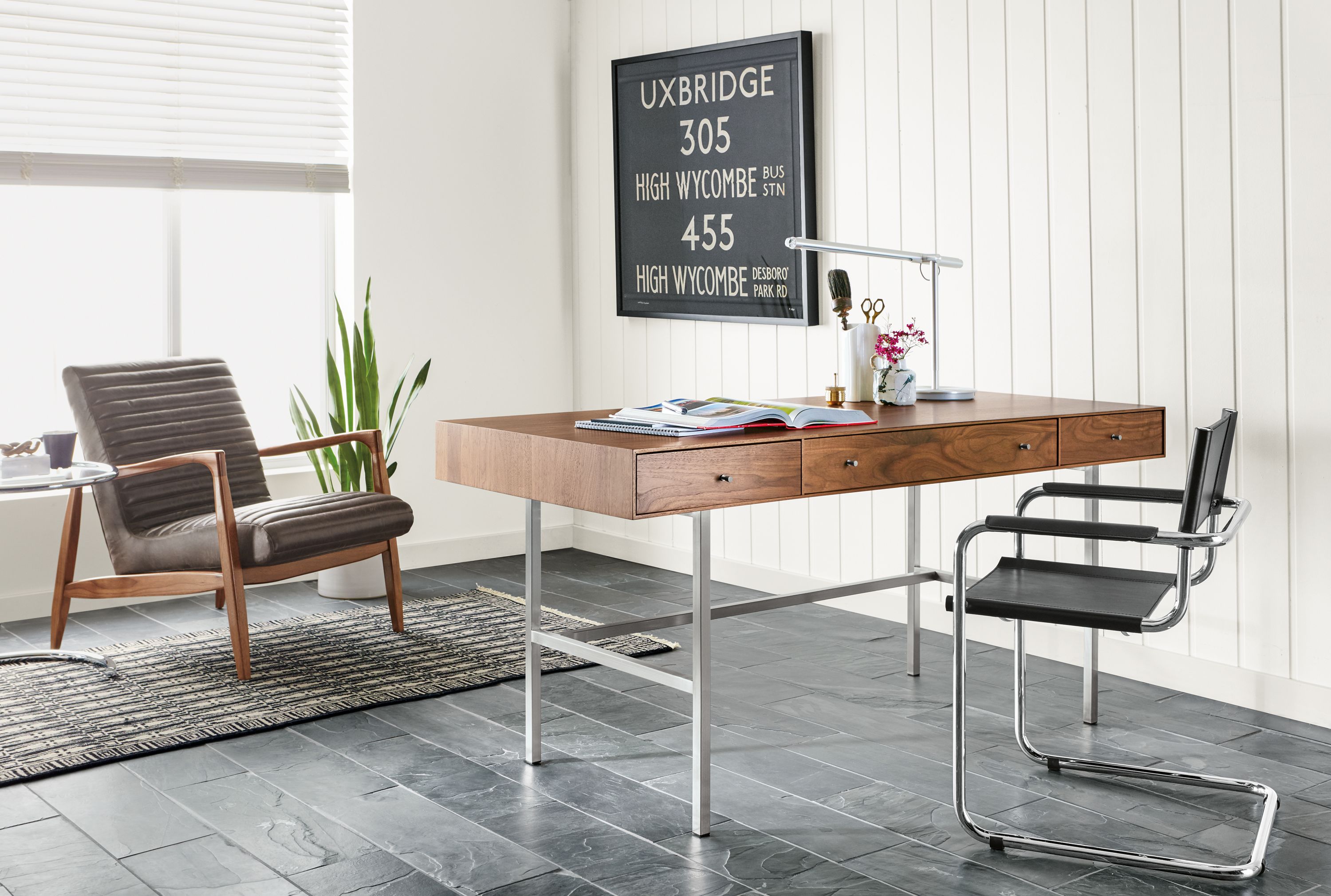Hudson three-drawer wood desk in office.