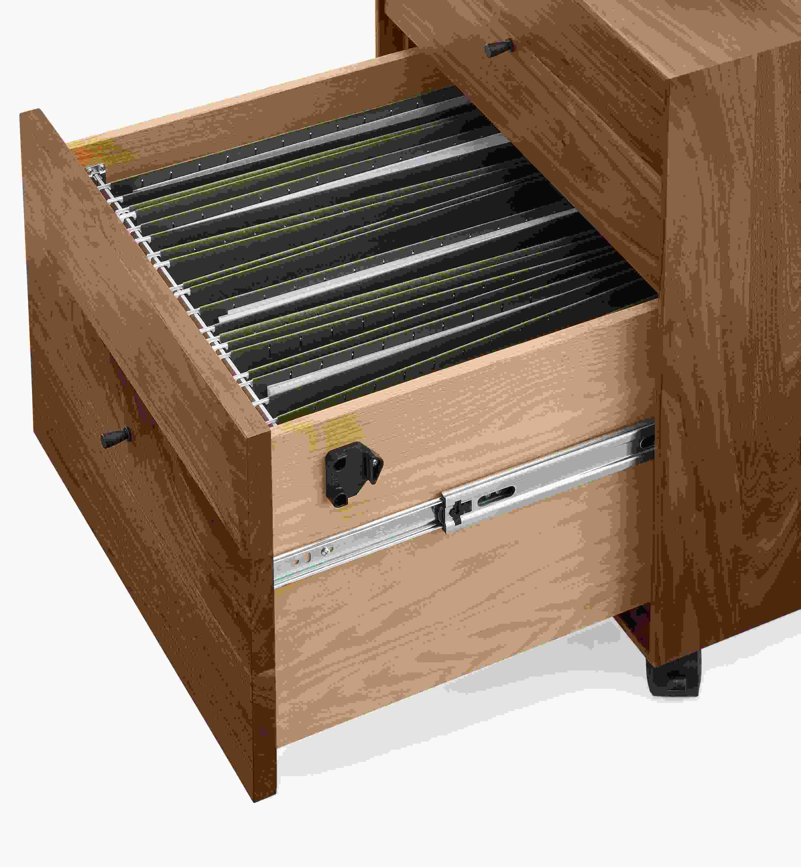 Detail of open-drawer on Hudson rolling file cabinet in walnut showing legal size file folders.