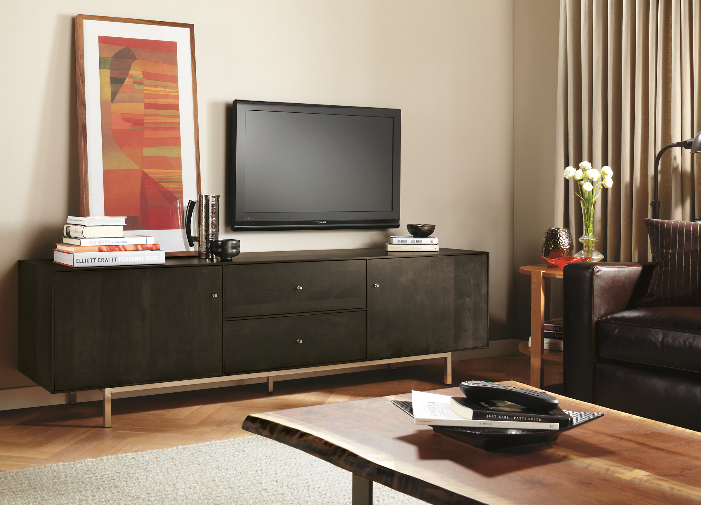 Living room with Hudson media cabinet with steel base in charcoal.