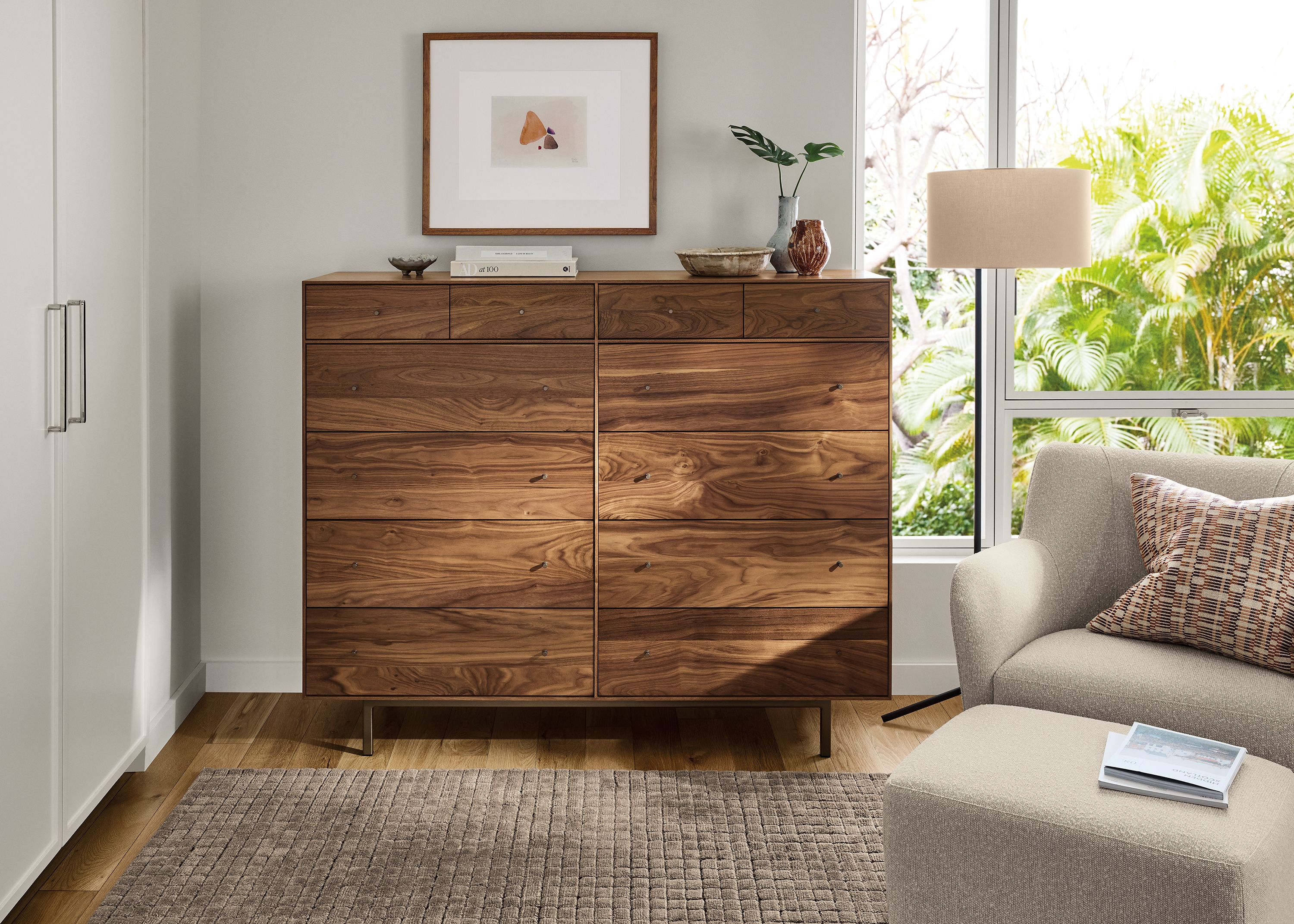 Large room with Hudson 60-wide, 12-drawer dresser in walnut and Lily chair and ottoman in conley natural.