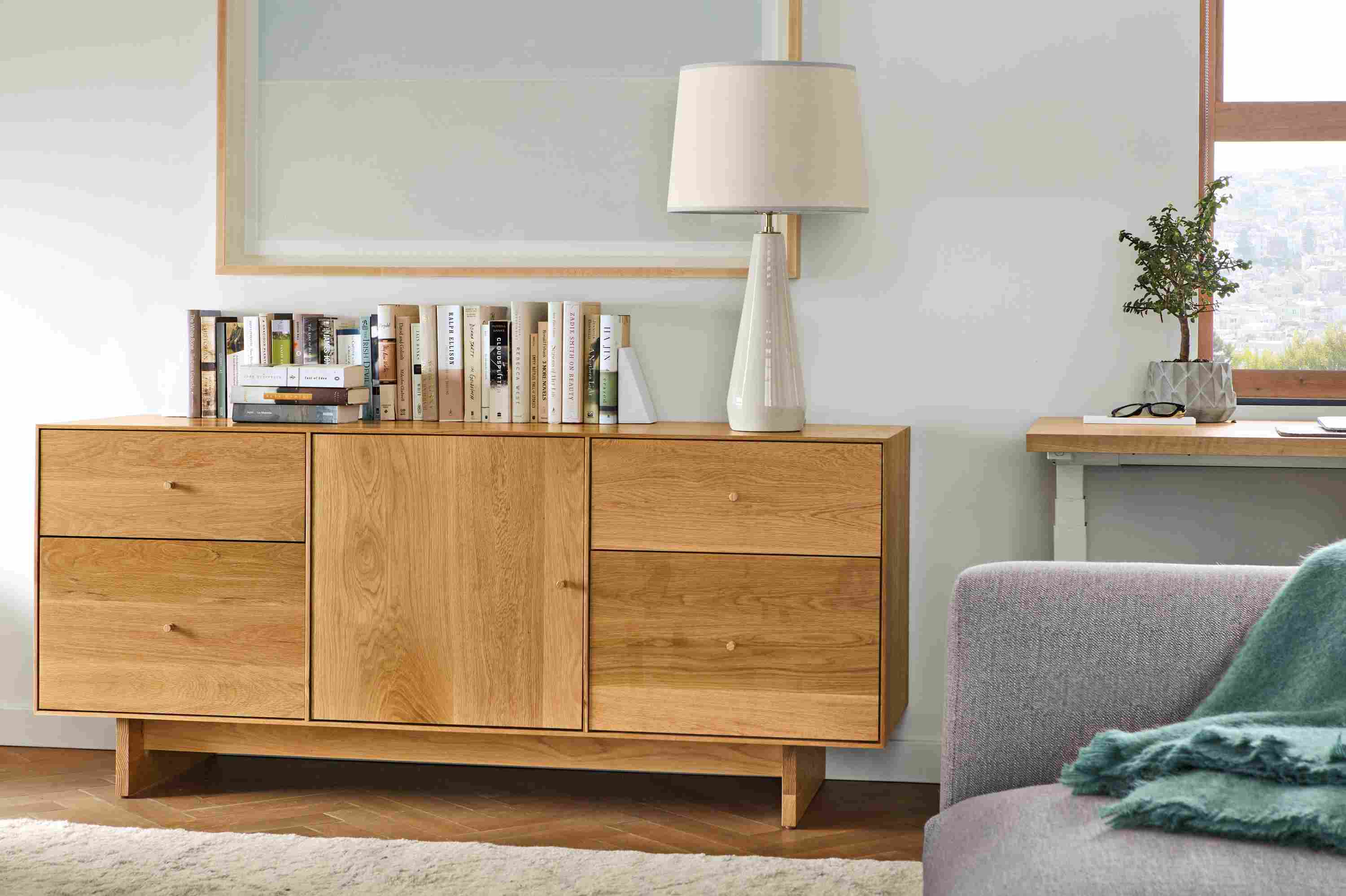 Close detail of Hudson 65-wide file cabinet in white oak with wood knobs and base.