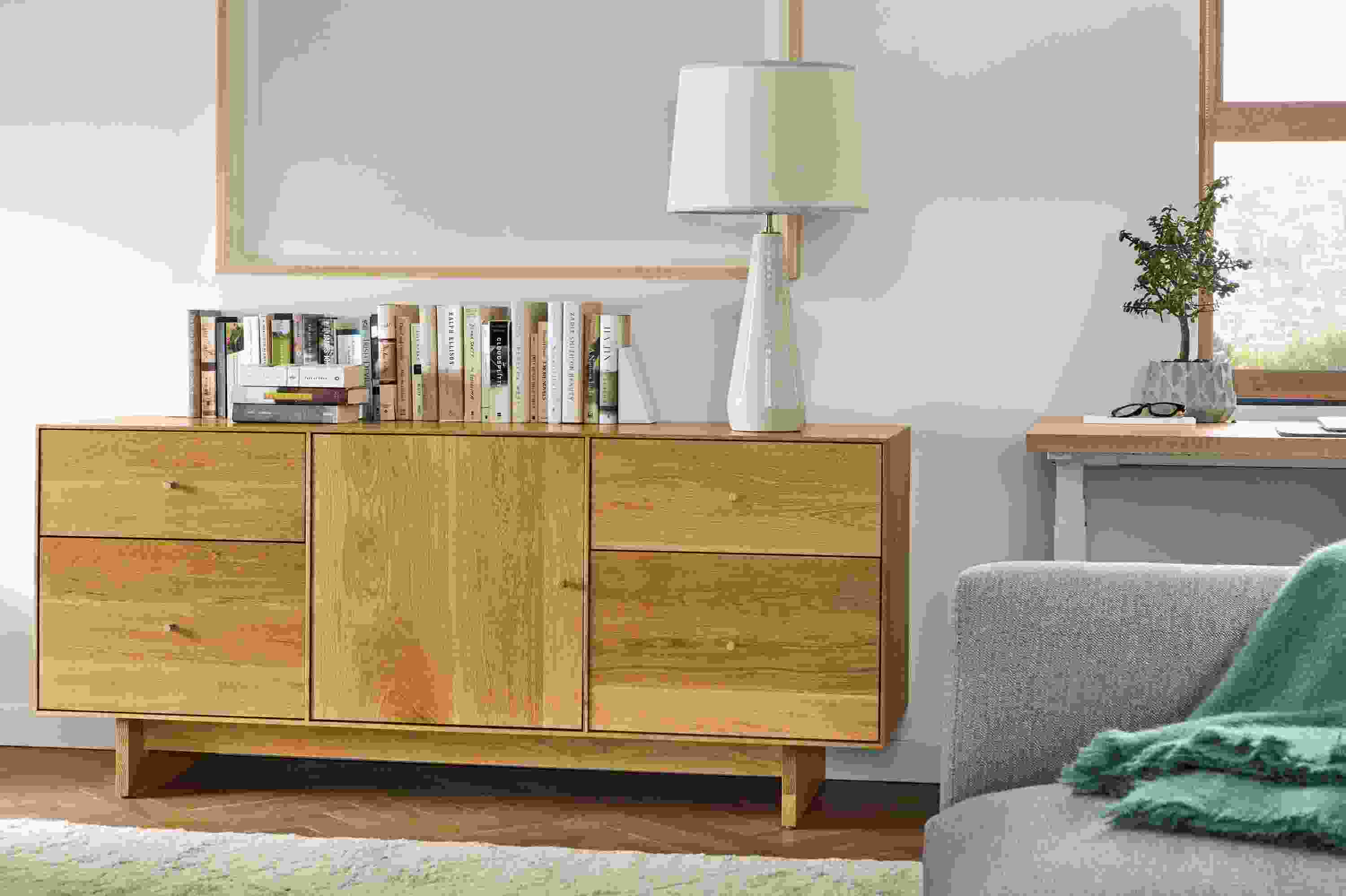 Close detail of Hudson 65-wide file cabinet in white oak with wood knobs and base.