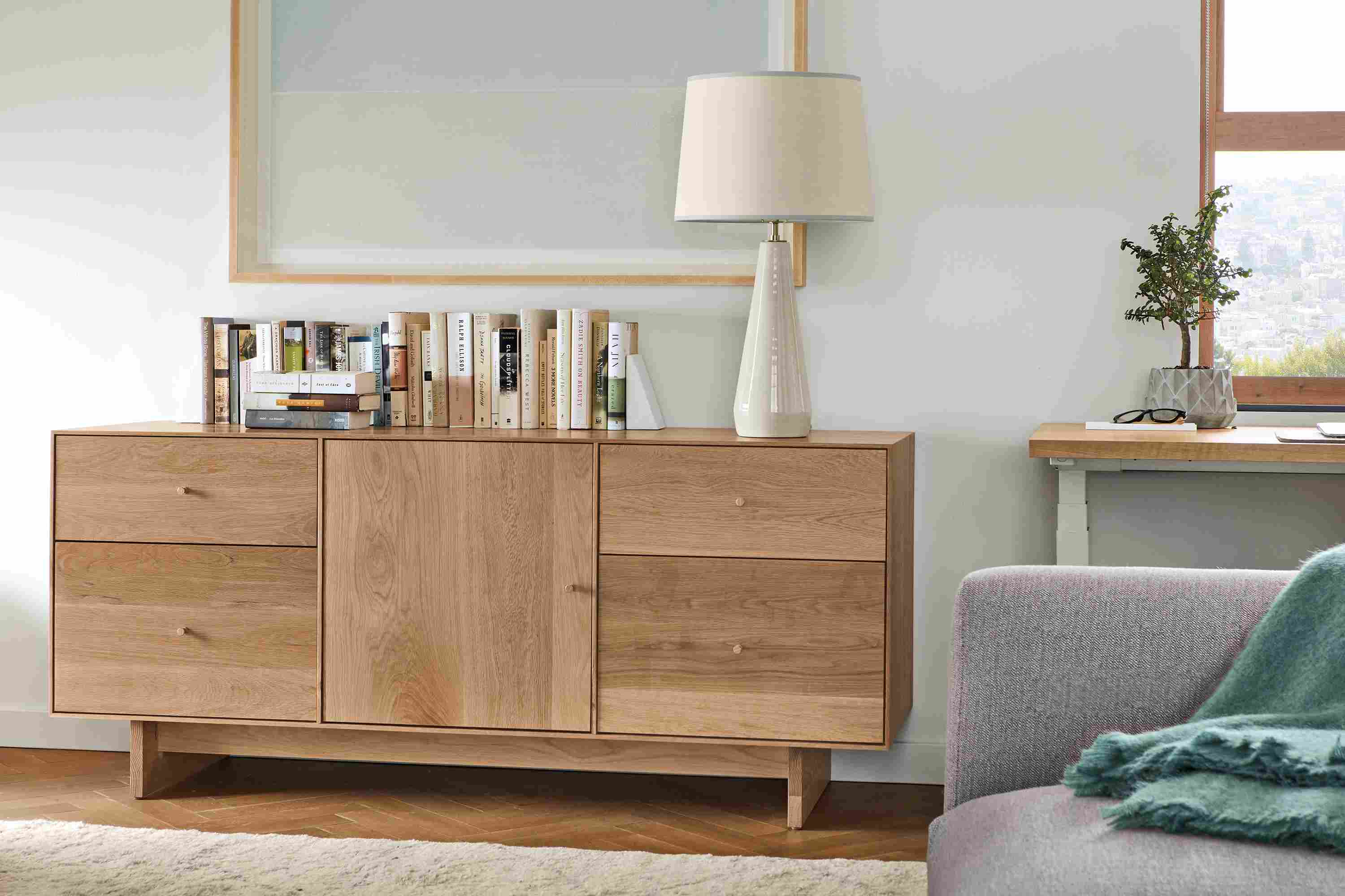 Close detail of Hudson 65-wide file cabinet in Rye with wood knobs and base.