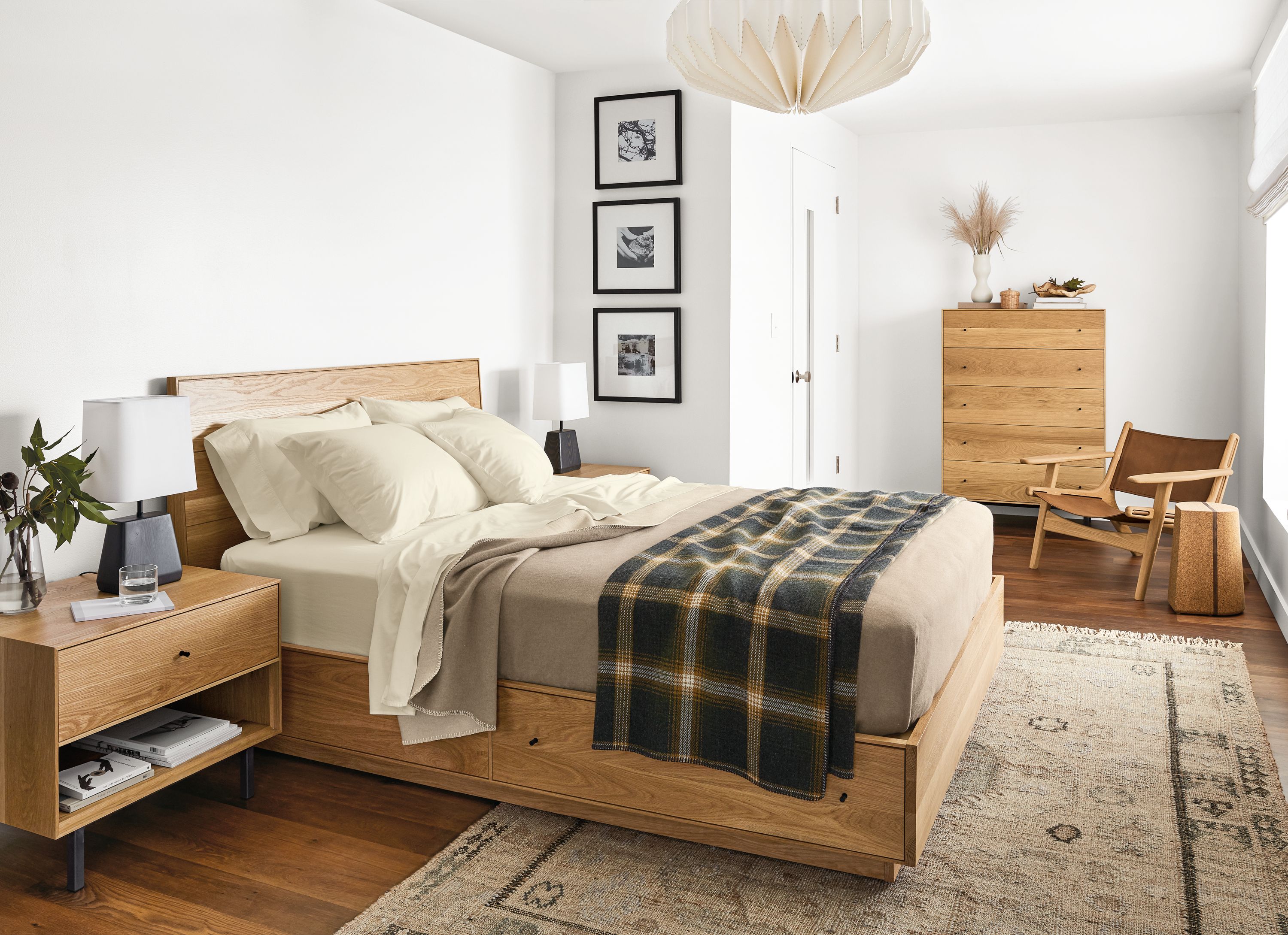 Detail of Hudson queen storage bed in white oak in bedroom.