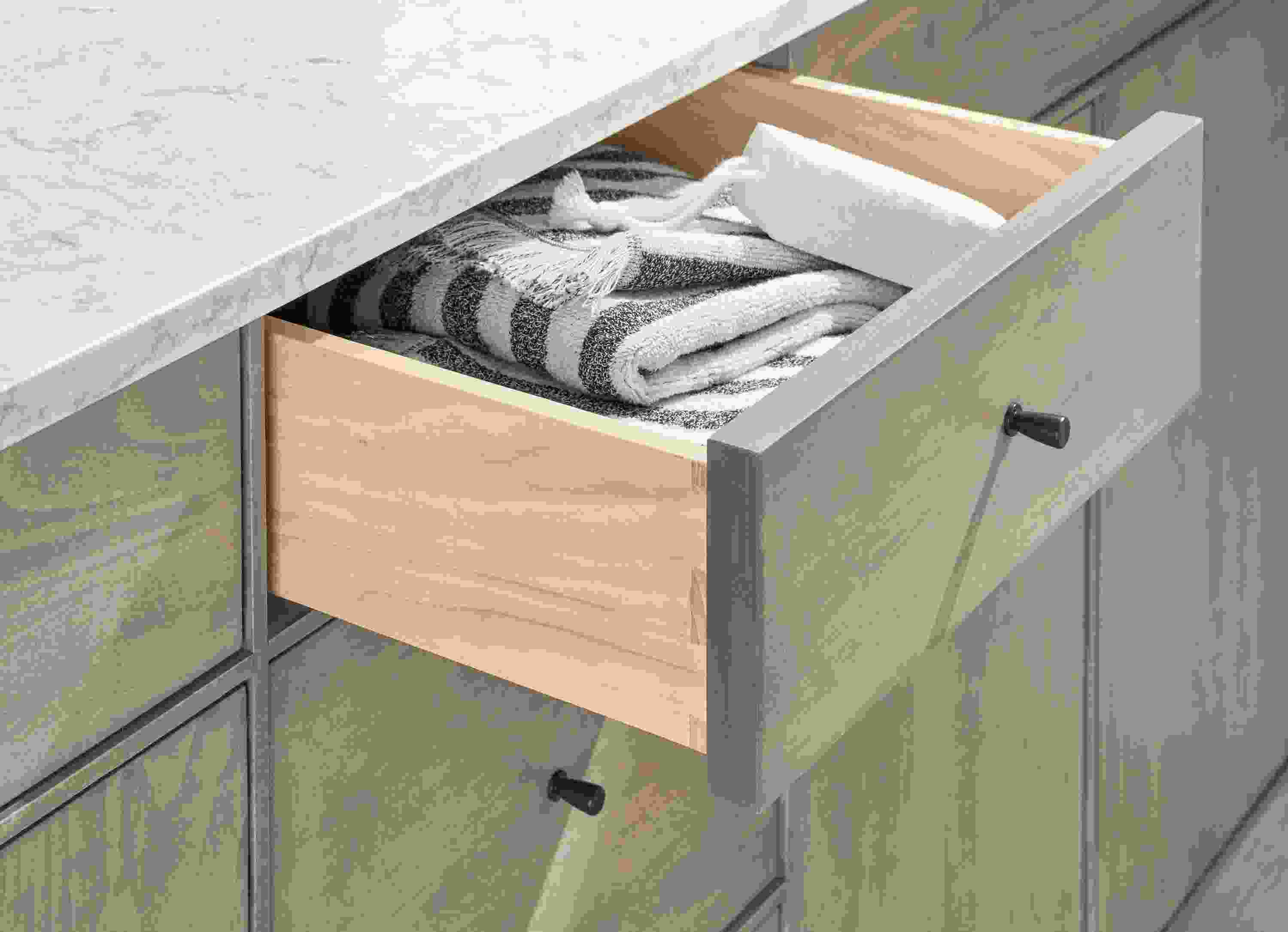 Detail of Hudson vanity with open drawer.