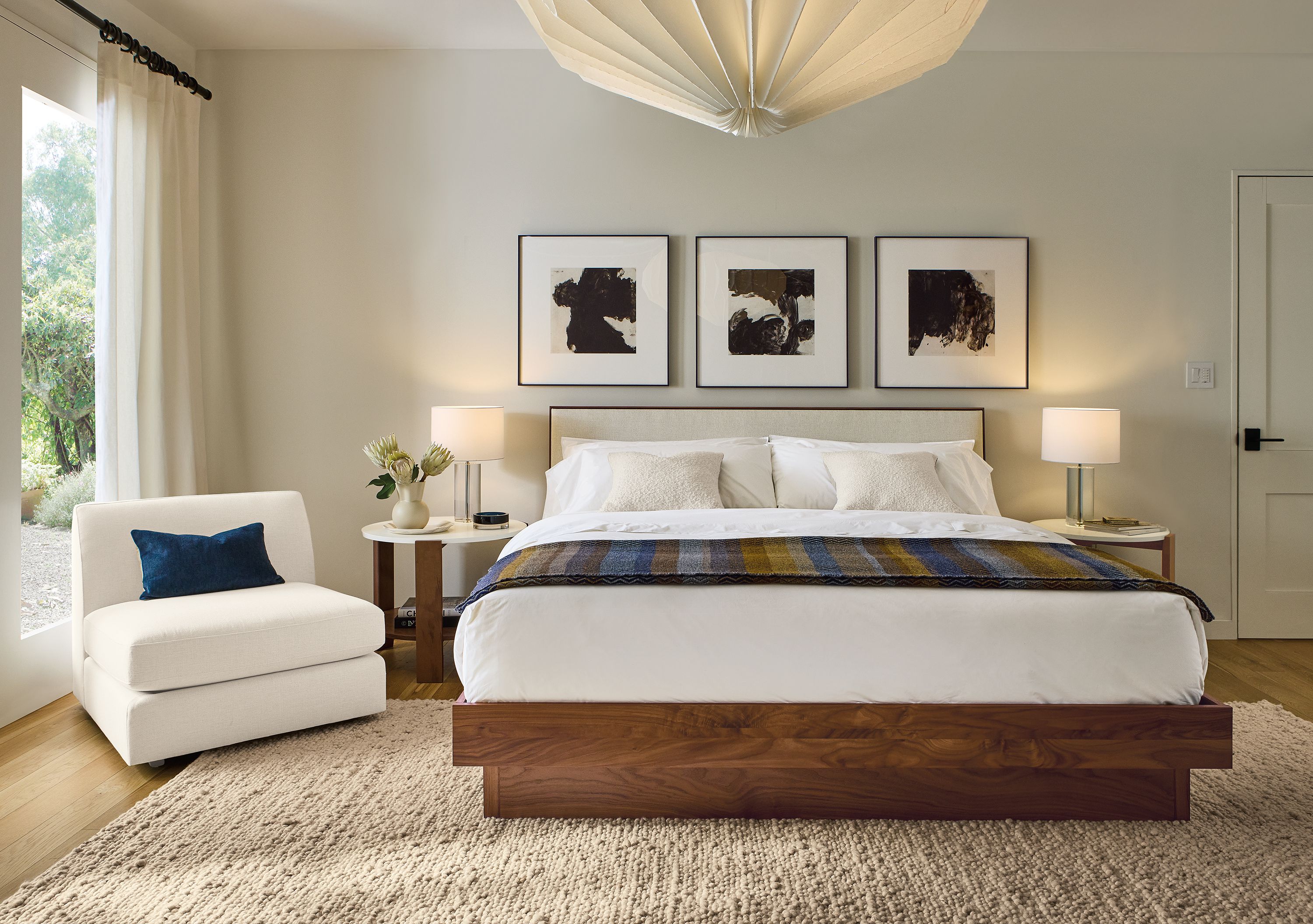 Bedroom with Hudson king bed in tepic ivory, 2 Brandt end table in walnut with Marbled Ivory Quartz.