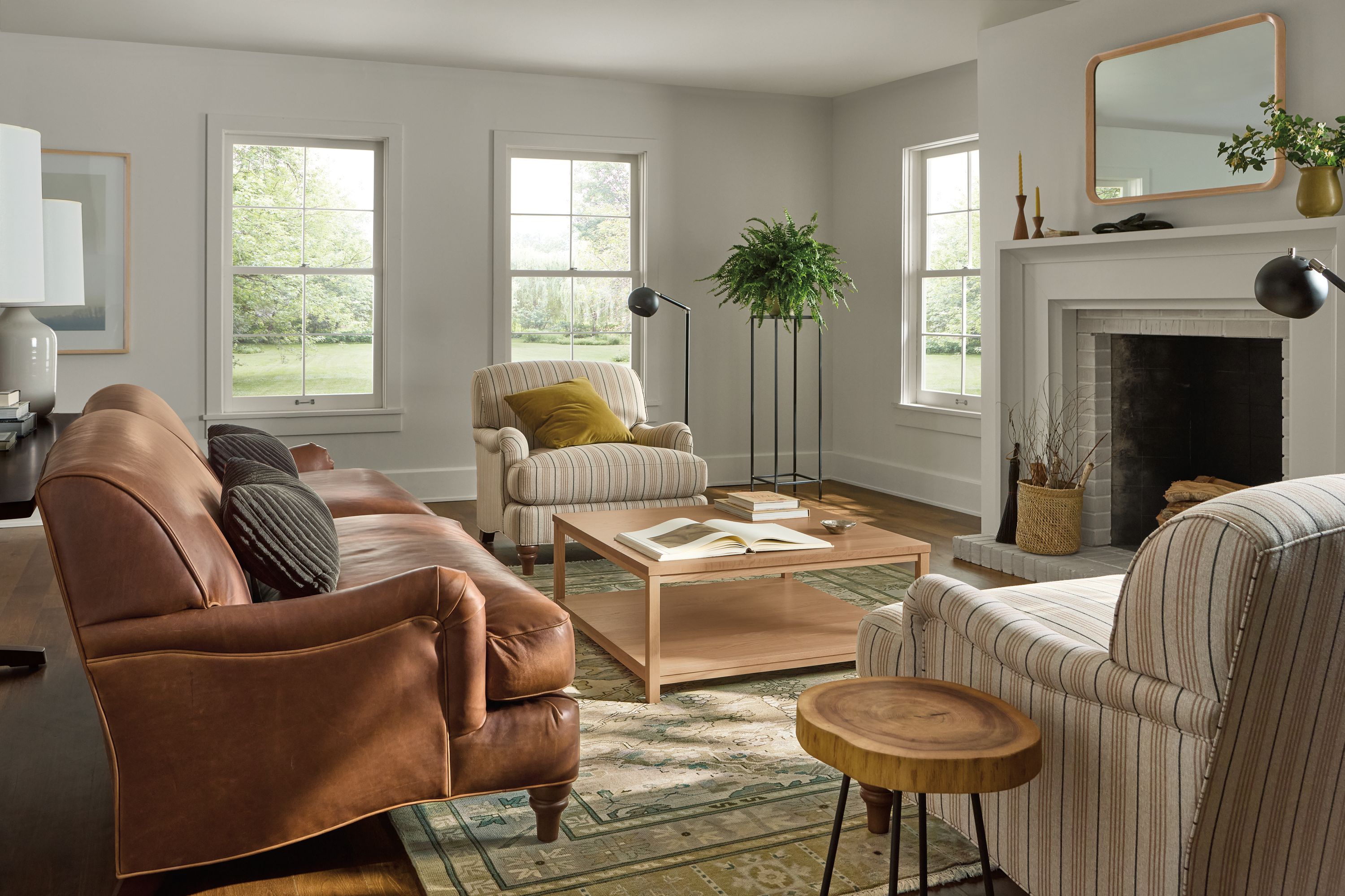 Large living room with Humphrey sofa in Sarto Cognac leather and 2 Humphrey chairs in Prescott Natural.