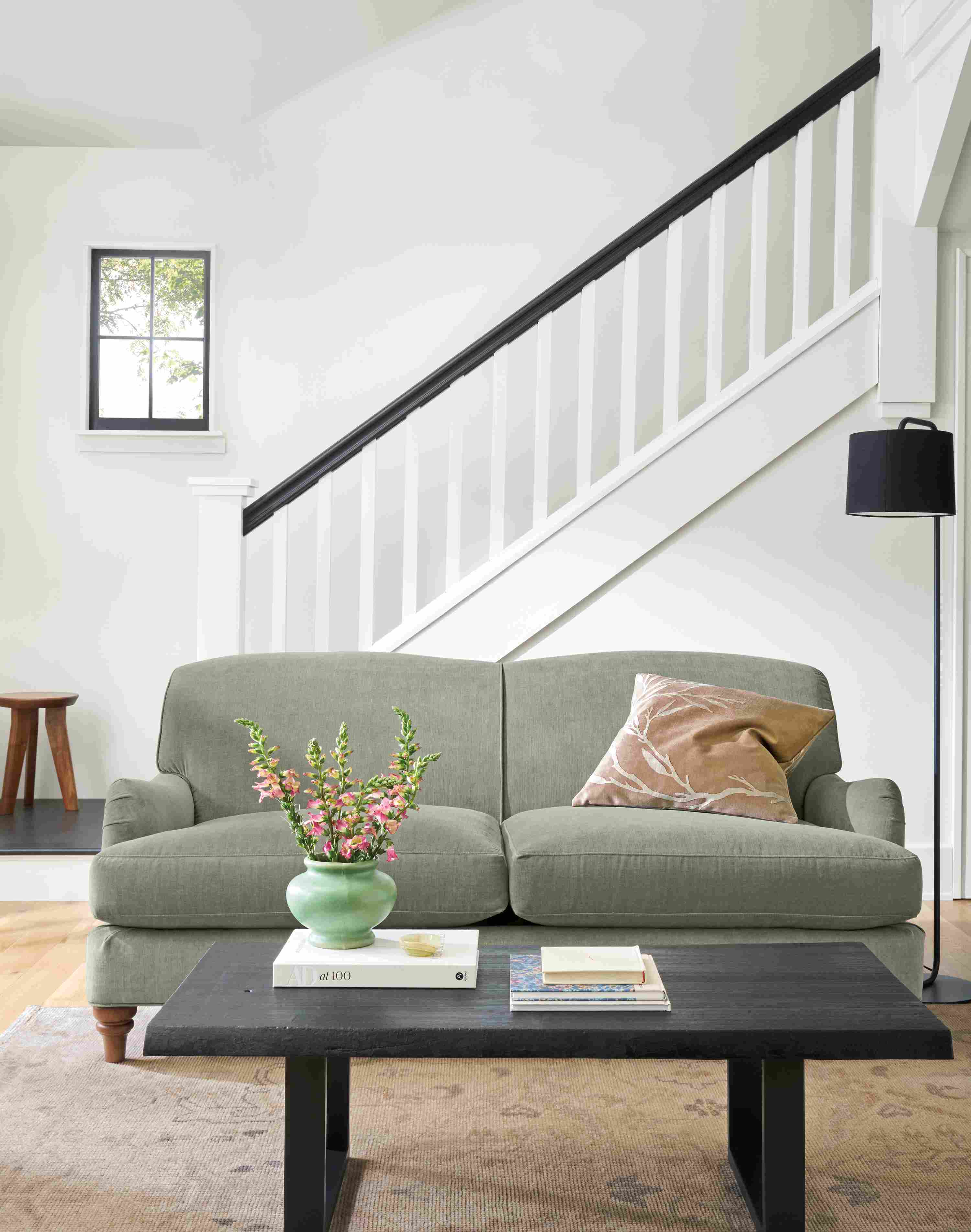 Living room with Humphrey 72-wide sofa in Windsor Sage, Prospect coffee table in charred reclaimed ash and Ophelia rug in  pumice.