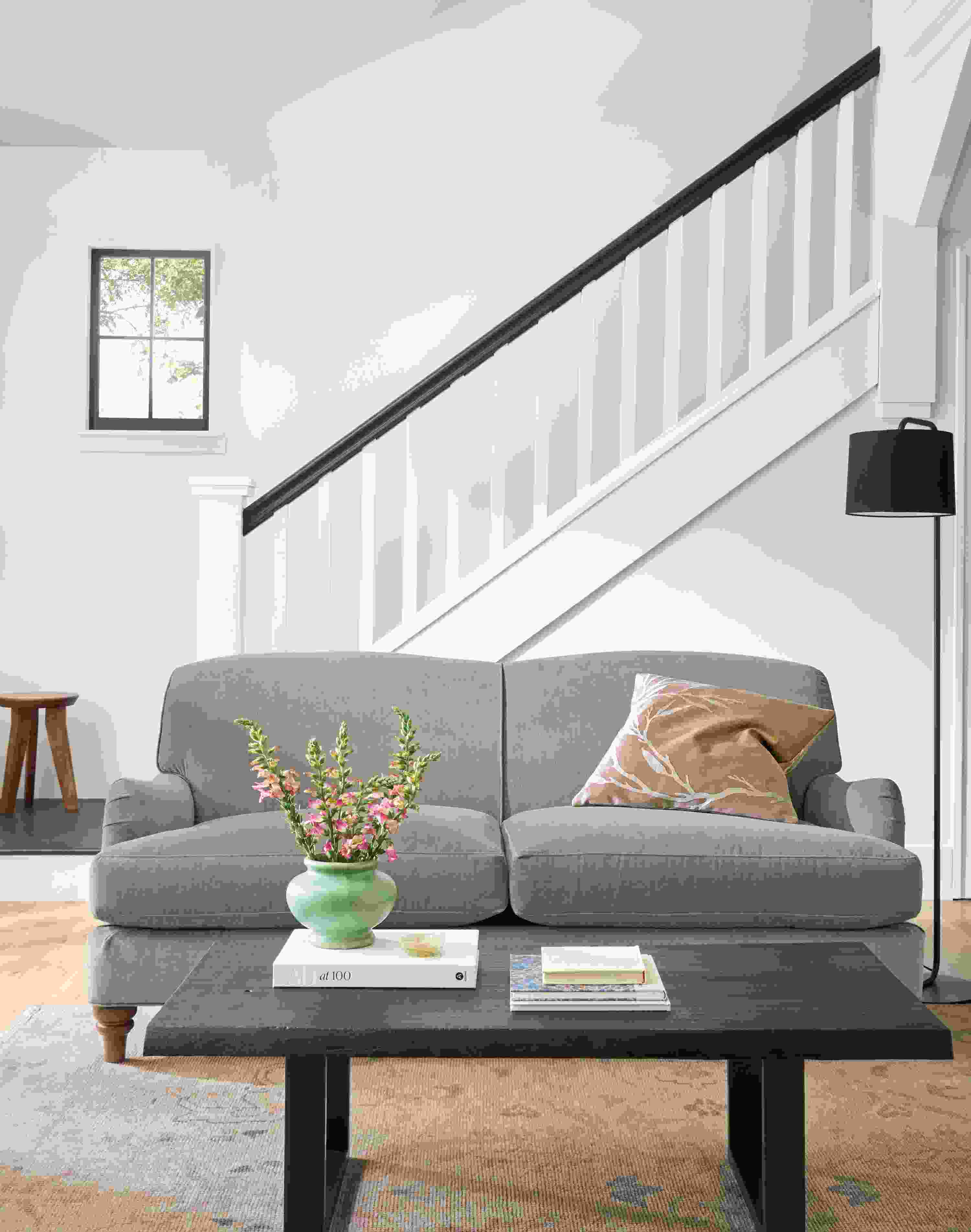 Living room with Humphrey 72-wide sofa in Windsor Sage, Prospect coffee table in charred reclaimed ash and Ophelia rug in  pumice.