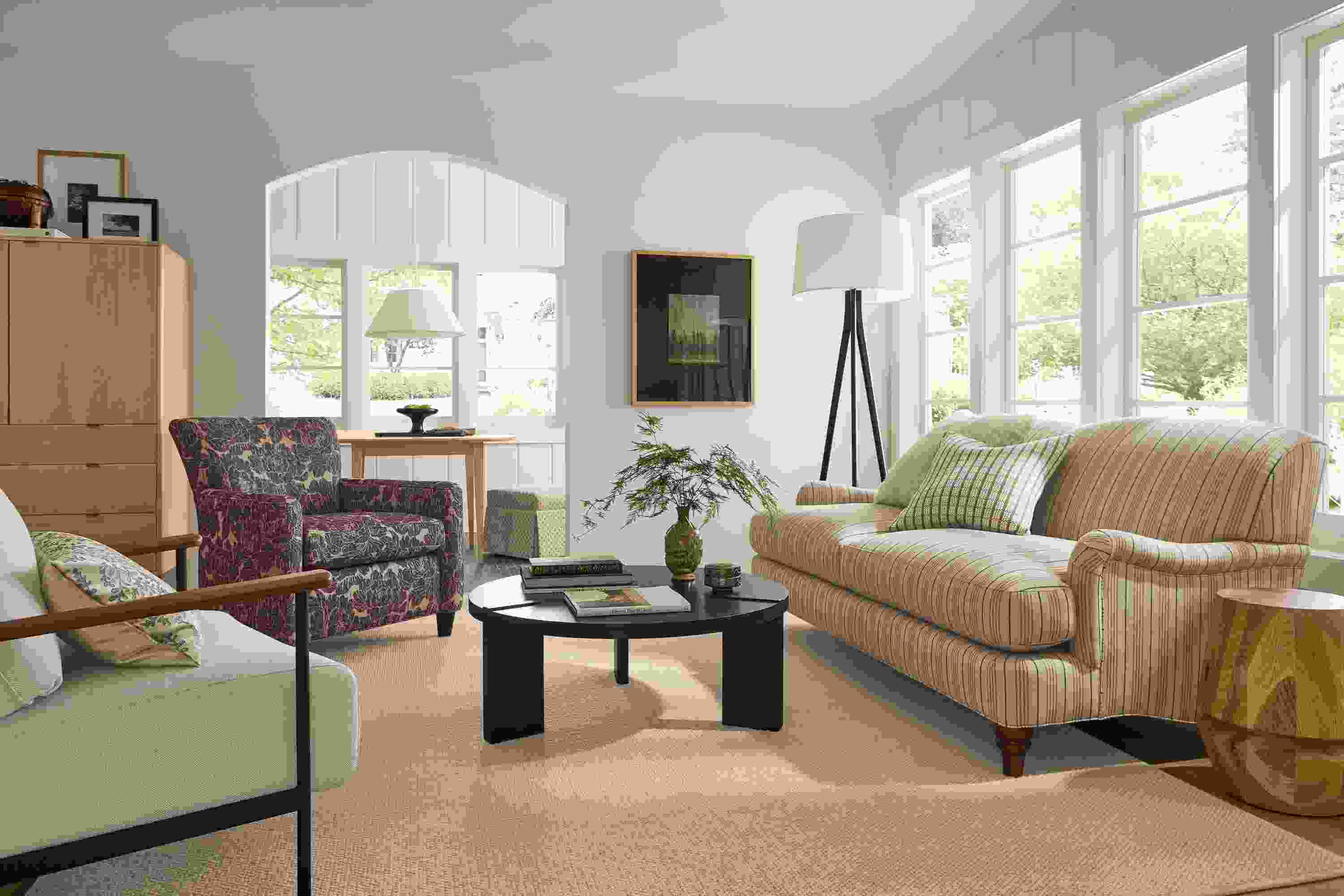 Living room with Humphrey sofa in Prescott Natural, Xavier chair in Gino Oatmeal and Hanover table in charcoal.
