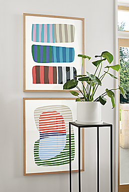 Close-up of Jorey Hurley artwork, Abstrac Stripes 1 and 2 with white oak frame and slim table in natural steel.