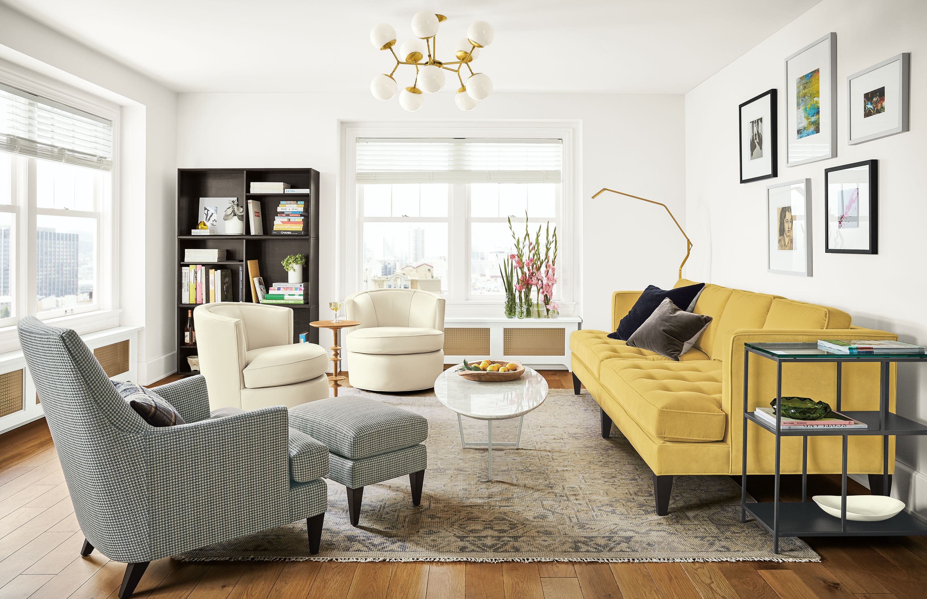 Detail of Hutton sofa in Banks Straw velvet in living room with Reach floor lamp.