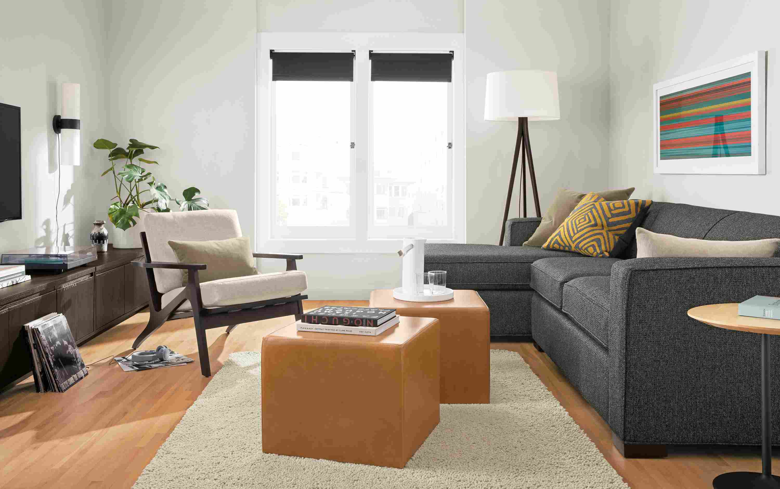 Living room with Ian sofa in Orla Grey, Sanna chair in Gino Oatmeal and Arden high-shag rug in oatmeal.